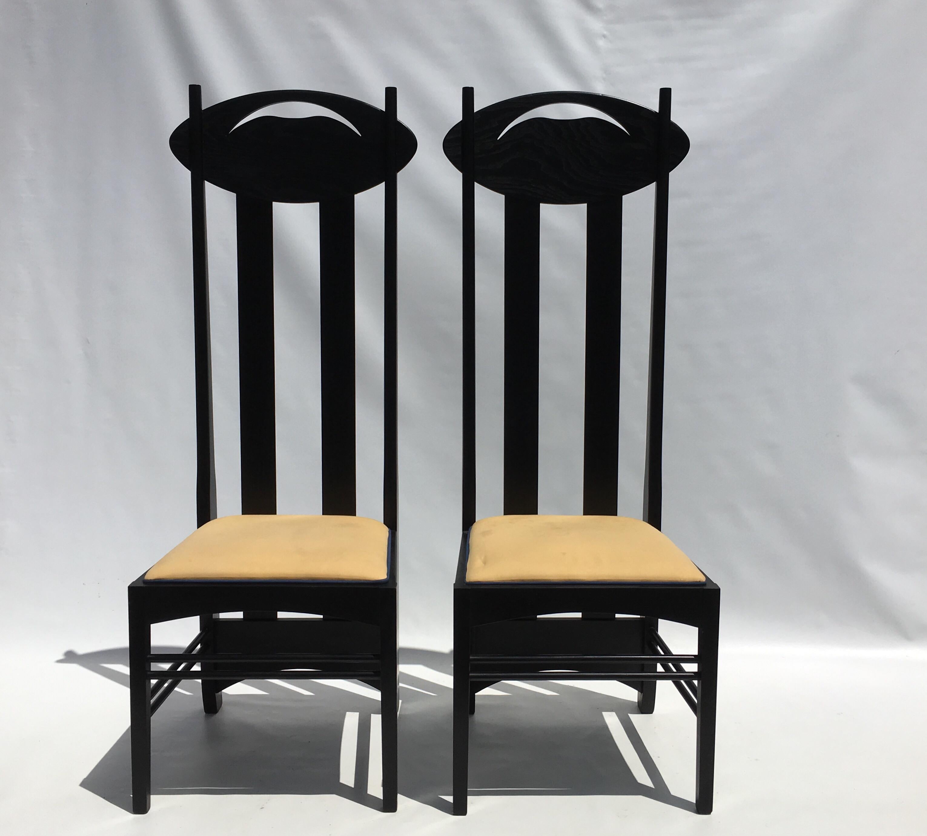 Two beautiful tall back chairs by Charles Rennie Mackintosh for Cassina. The chairs are unsigned. The seats need to be reupholstered.