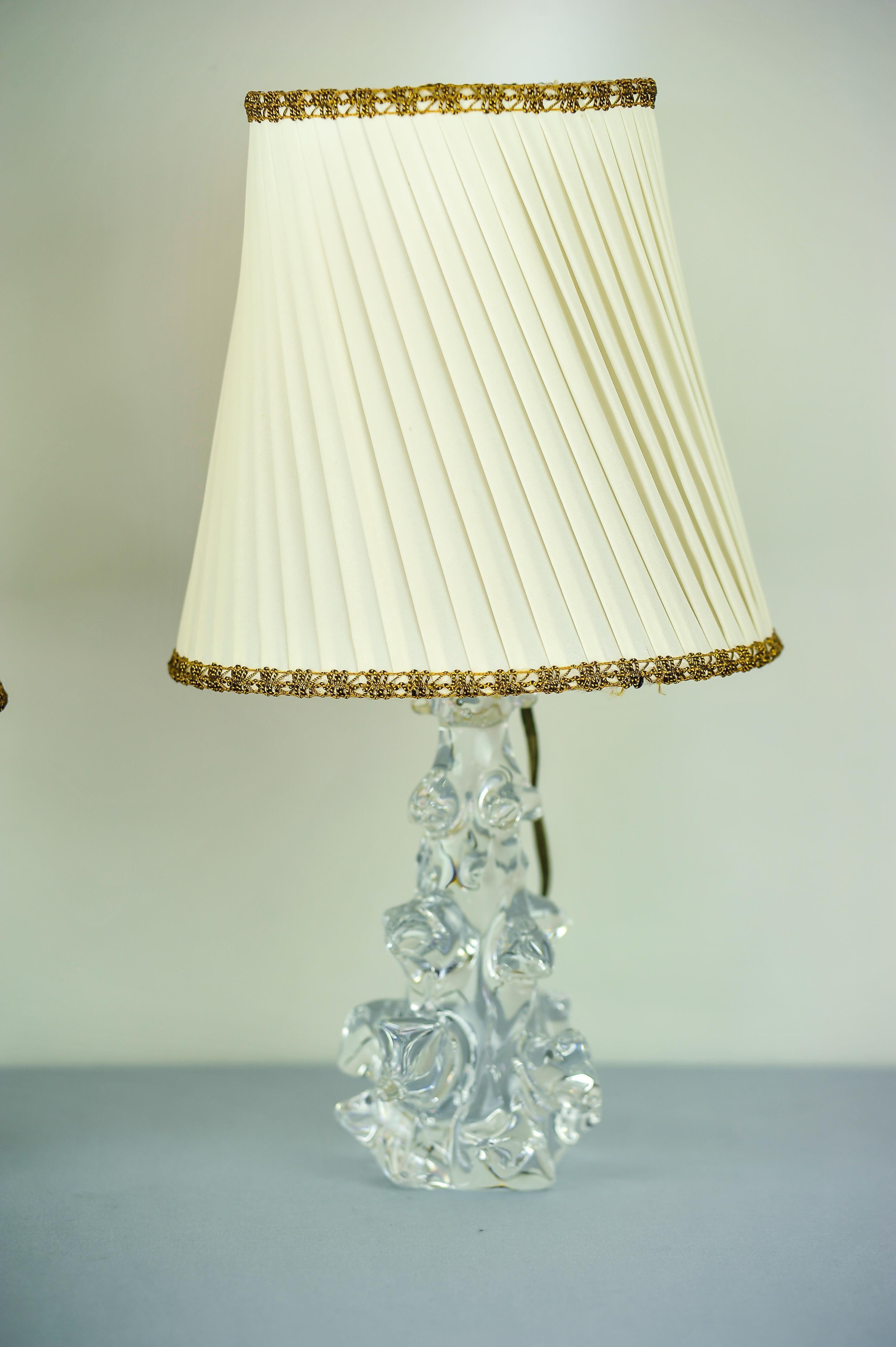 Two Charles Schneider crystal glass table lamps and original fabric shades, 1960s.
Original condition.