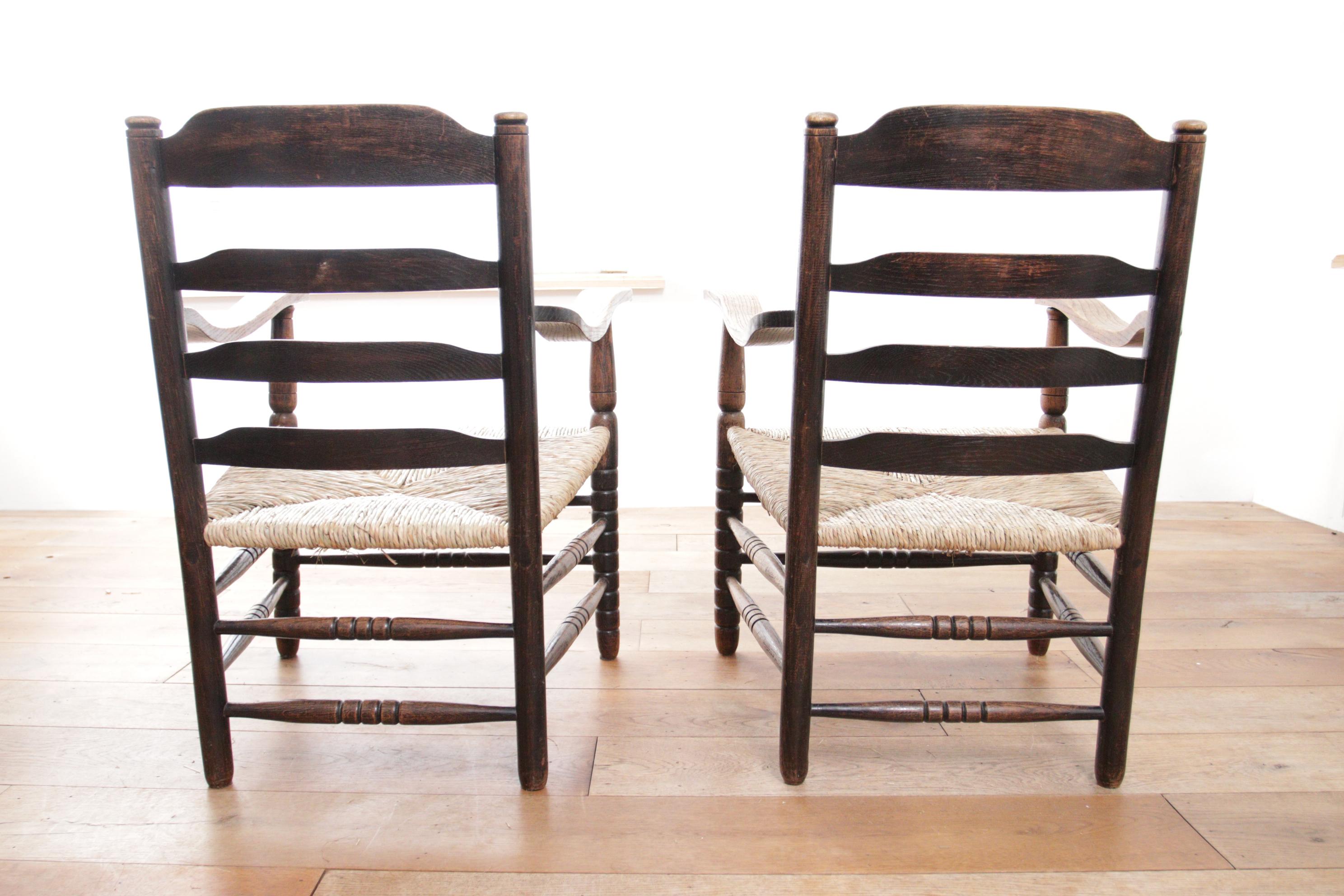 Early 20th Century Two Charming Dutch Rural Ladder Back Oak Rush Seat Armchairs 1920's For Sale