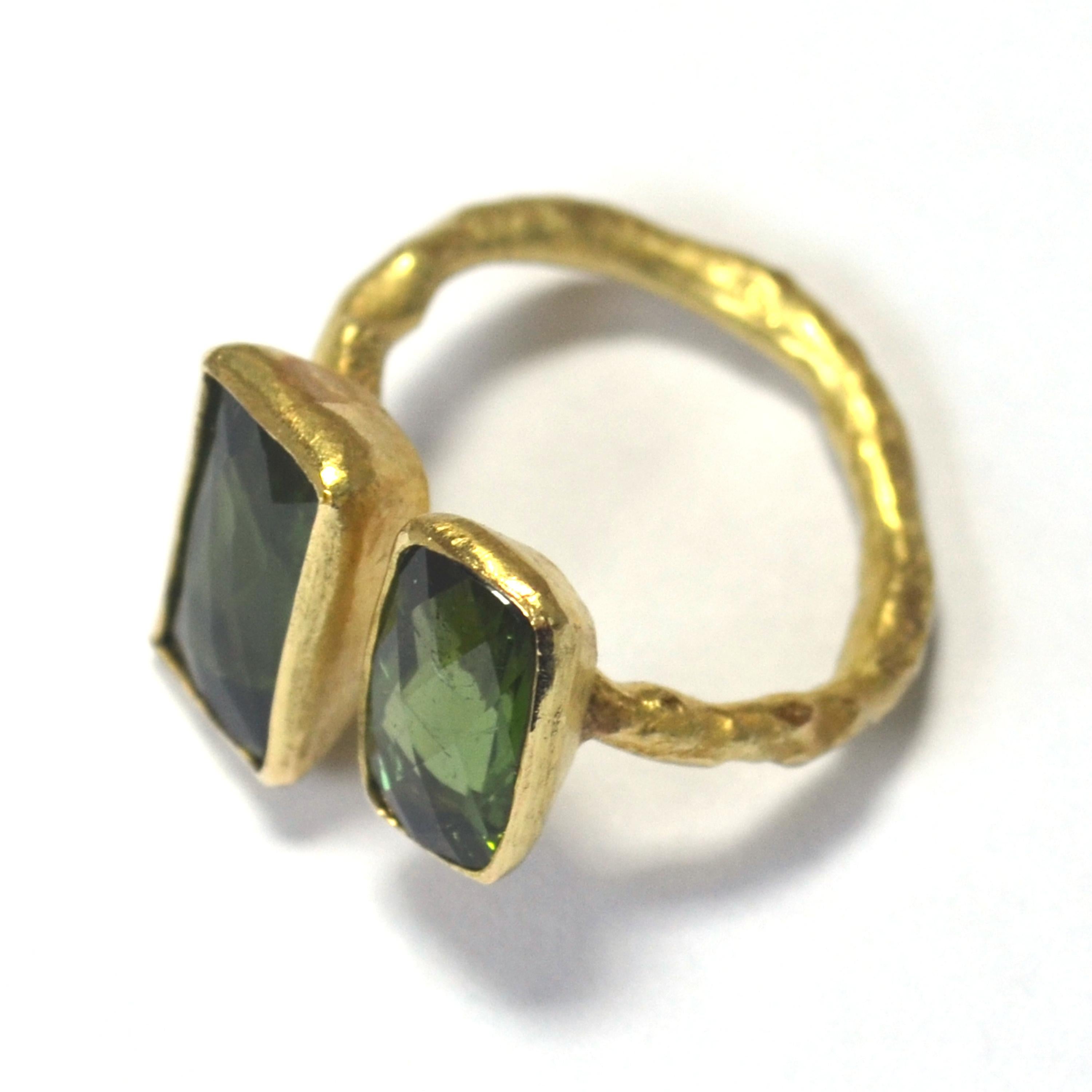 18k yellow gold reticulated texture ring handmade by Disa Allsopp in her London Studio. Features two stunning bottle green tourmaline stones, rectangular shape with chequerboard faceting on the top table of the stones. The deep hues of the stones