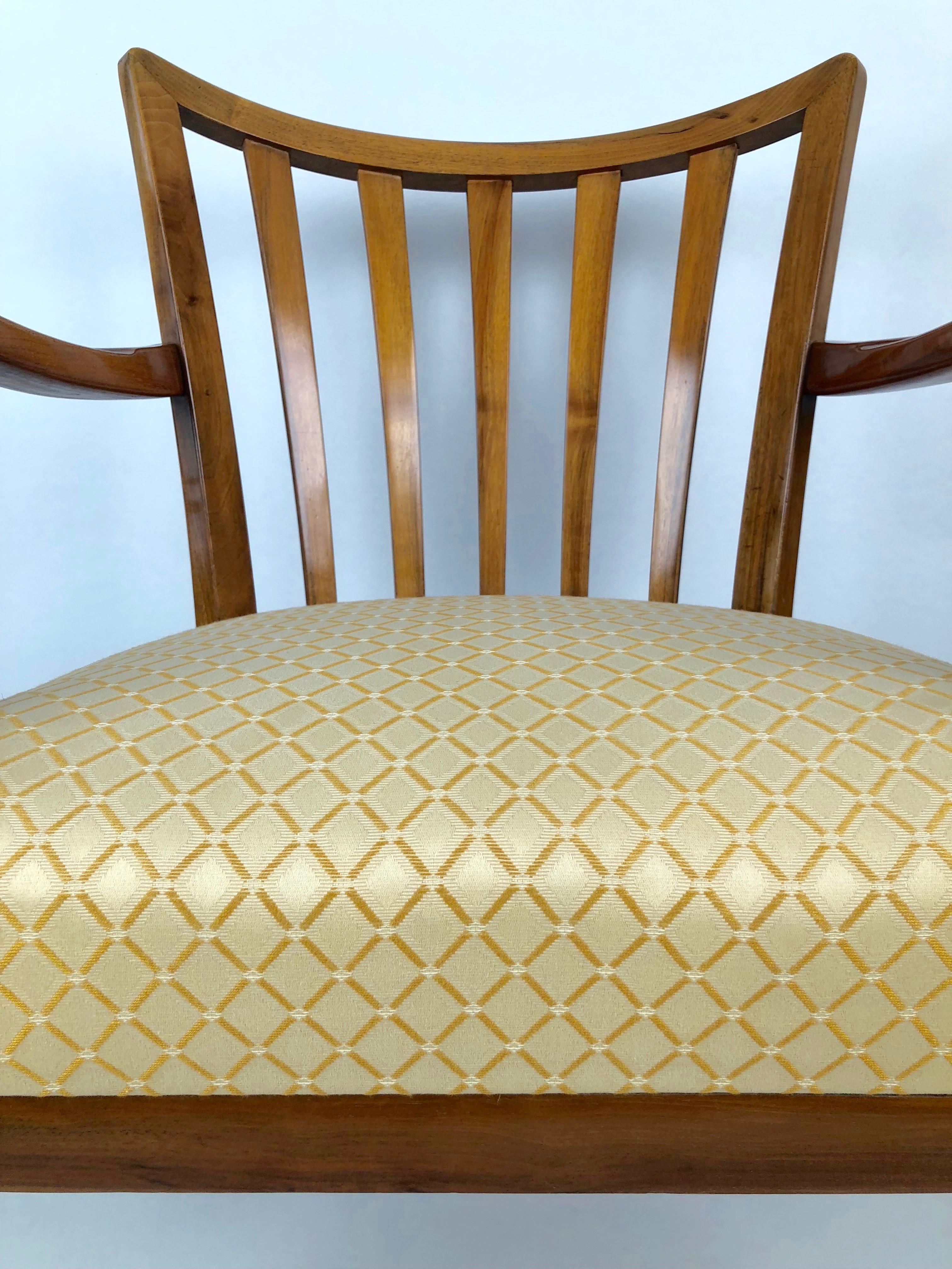 These two chairs come from a time in Austrian design where craftsmanship and design are combined with the best materials to make beautiful furniture. Cherrywood and walnut were used only in the bests designs. The seating uses coil springs and is