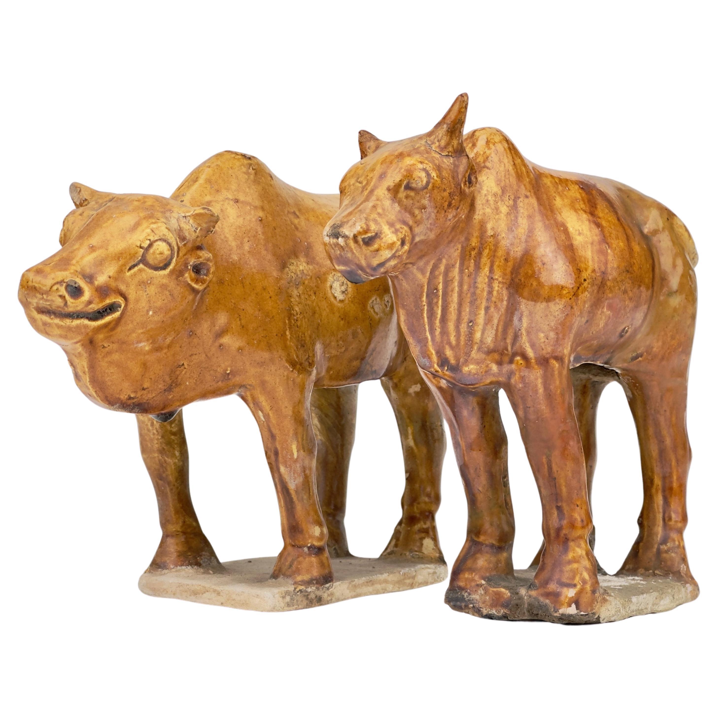 Two Chestnut-glazed Pottery Figure of Sacred Bulls, Tang Dynasty For Sale