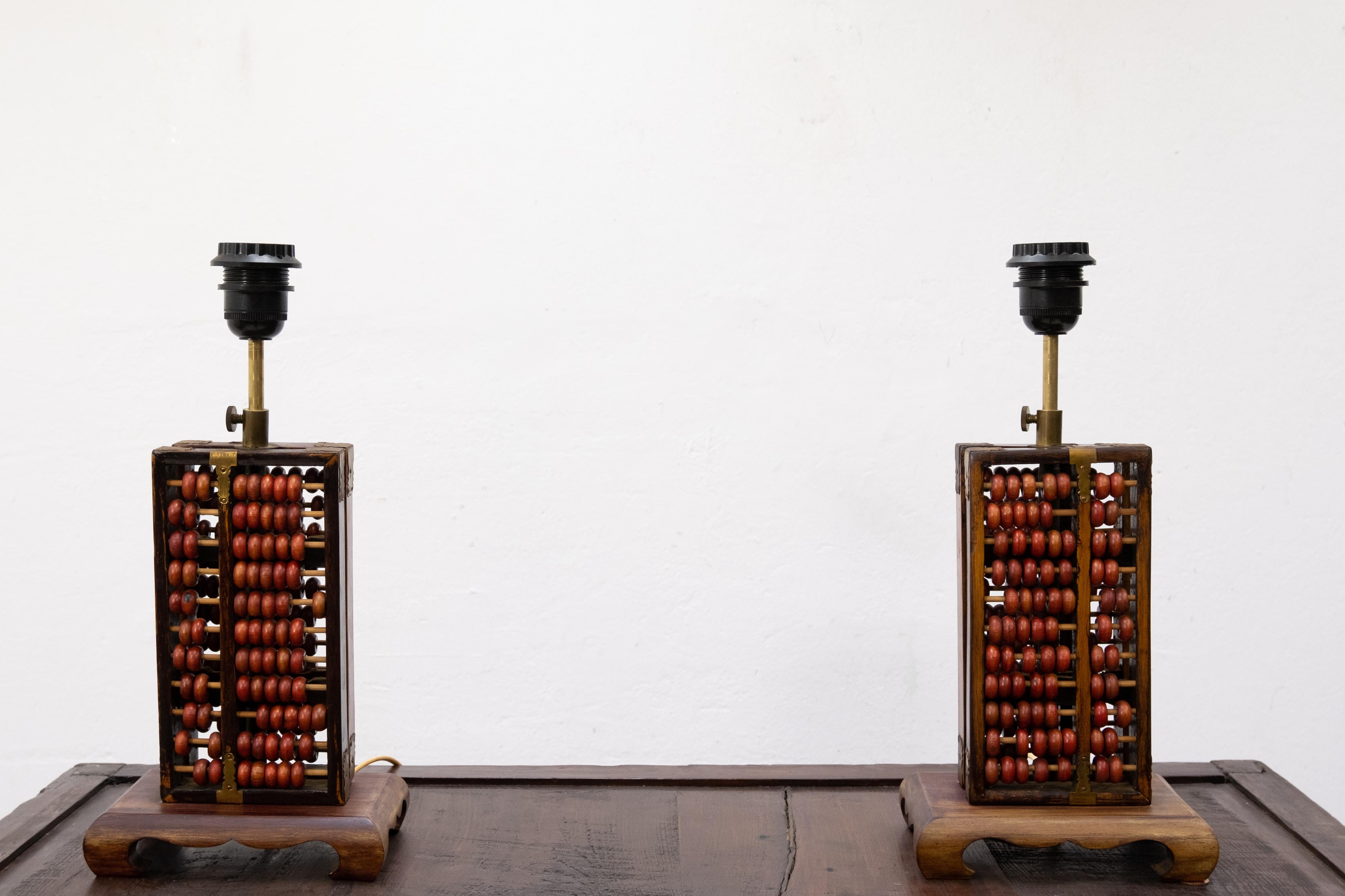 Two lovely abacus table lamps. Manufactured by Red Lion, China, 1960s. And very rare still with there original shades. Good condition. Nice and decorative lamps.