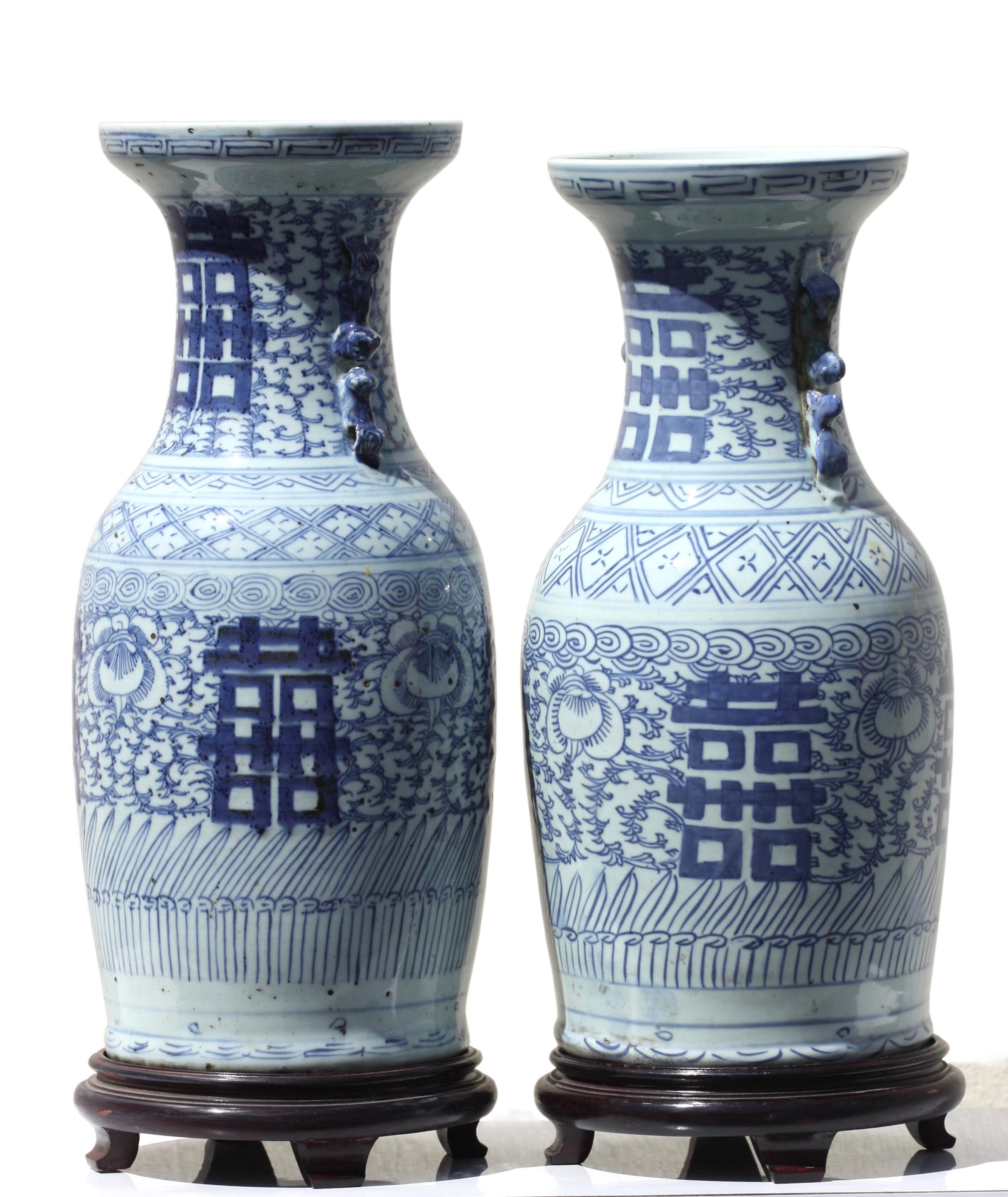 Two Chinese blue and white porcelain vases
Qing dynasty, 18th-19th century
decorated with flower sprays, Height 17.25 in. (69.21 cm.) and 16.5 in. (41.91 cm.) 
Diameter 8 in. (20.32 cm.).
 