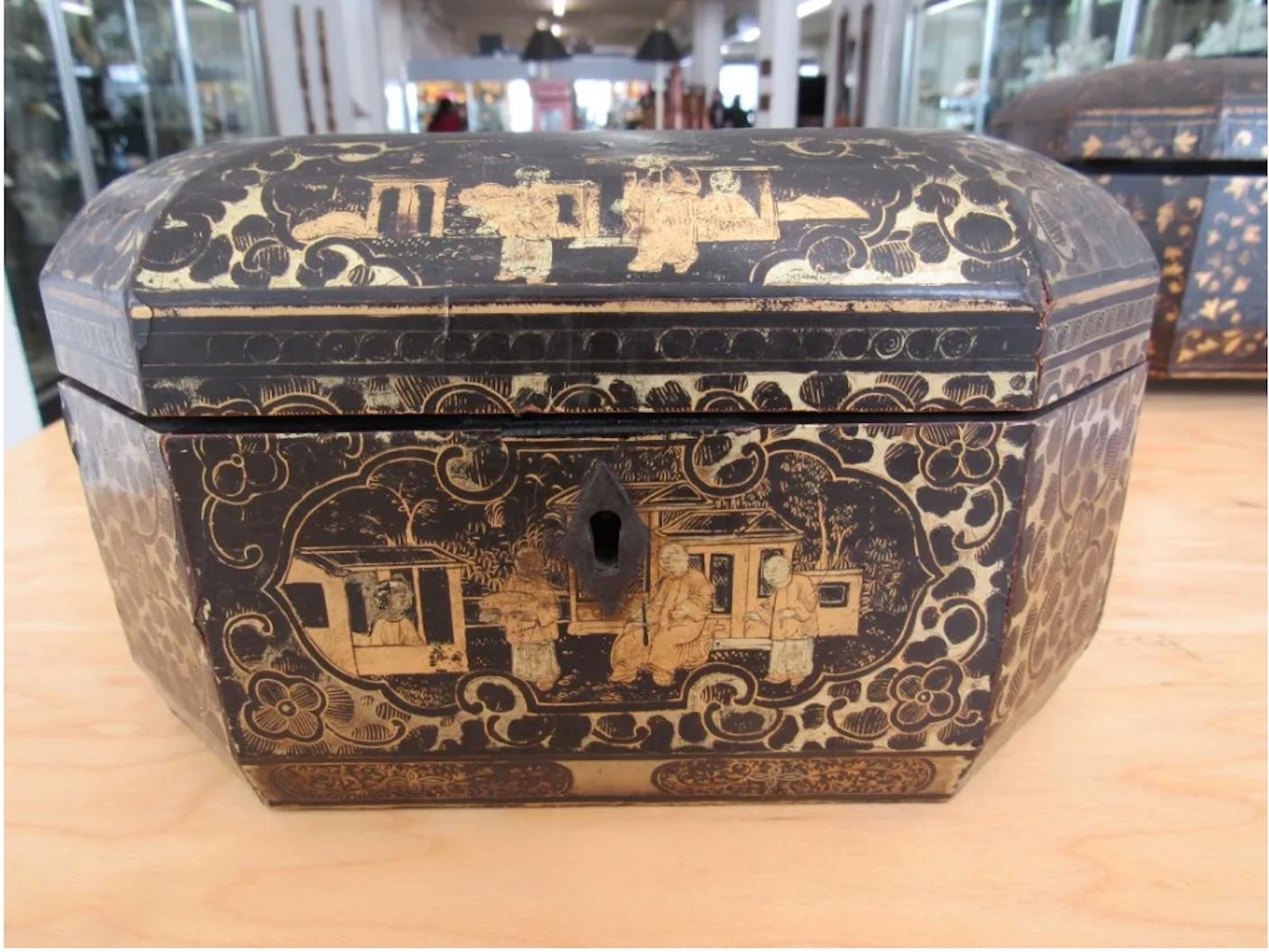 A two Chinese export lacquered tea caddys for The English Market. With two fitted pewter canisters on the interior. Together with a Chinese export lacquered box with remnants of gilt decoration (5 1/2