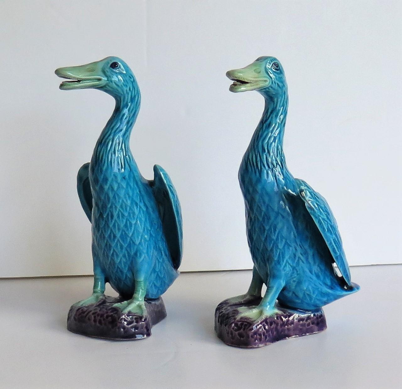 This are two different Chinese export porcelain goose birds, decorated in polychrome enamels and dating to the 1950s.

The bird figurines are both well modelled in different positions and very life like, with the goose standing upright on a rocky