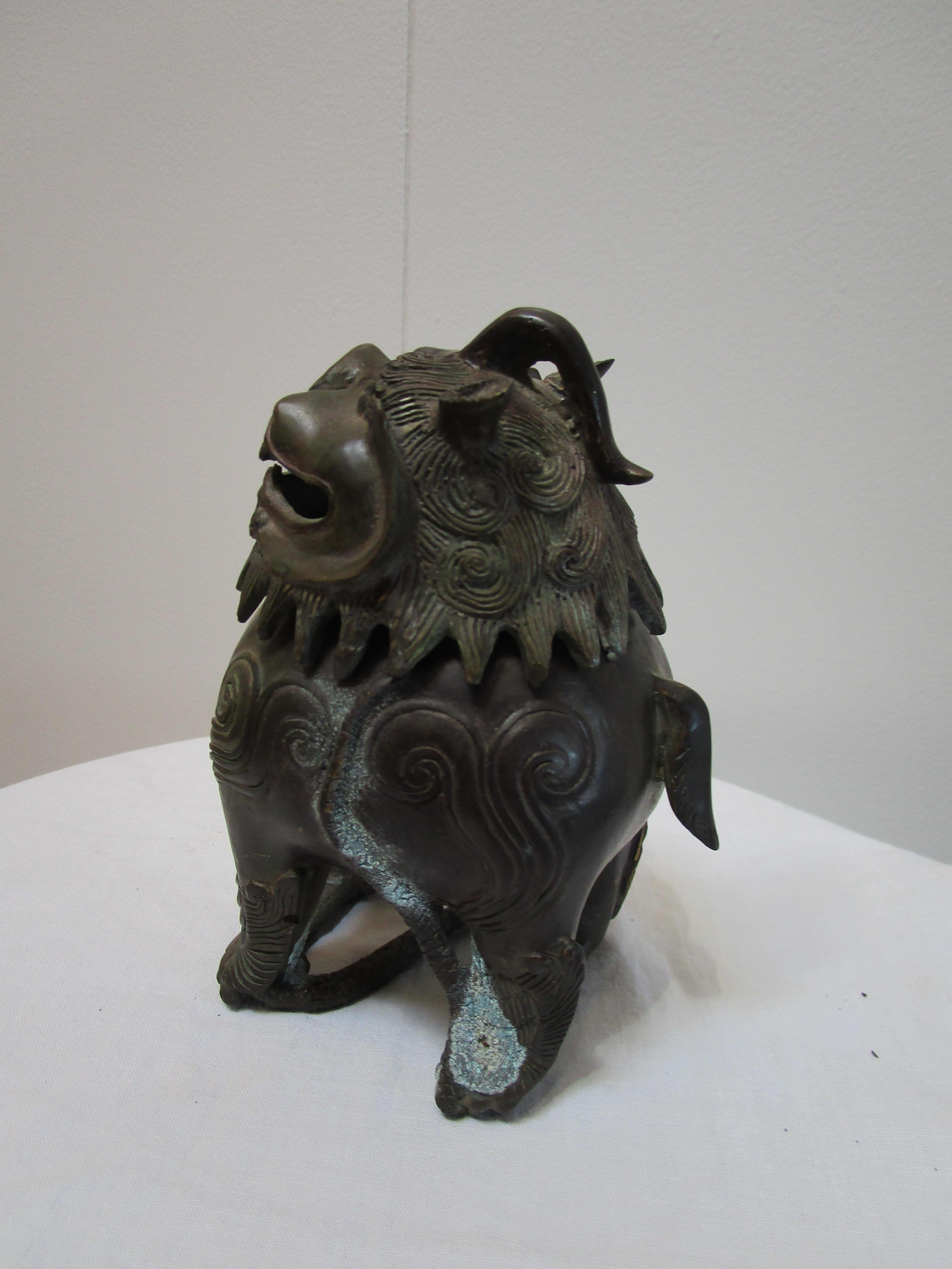 Cast Two Chinese Guardian Lions in Bronze, Iron, Early 20th Century