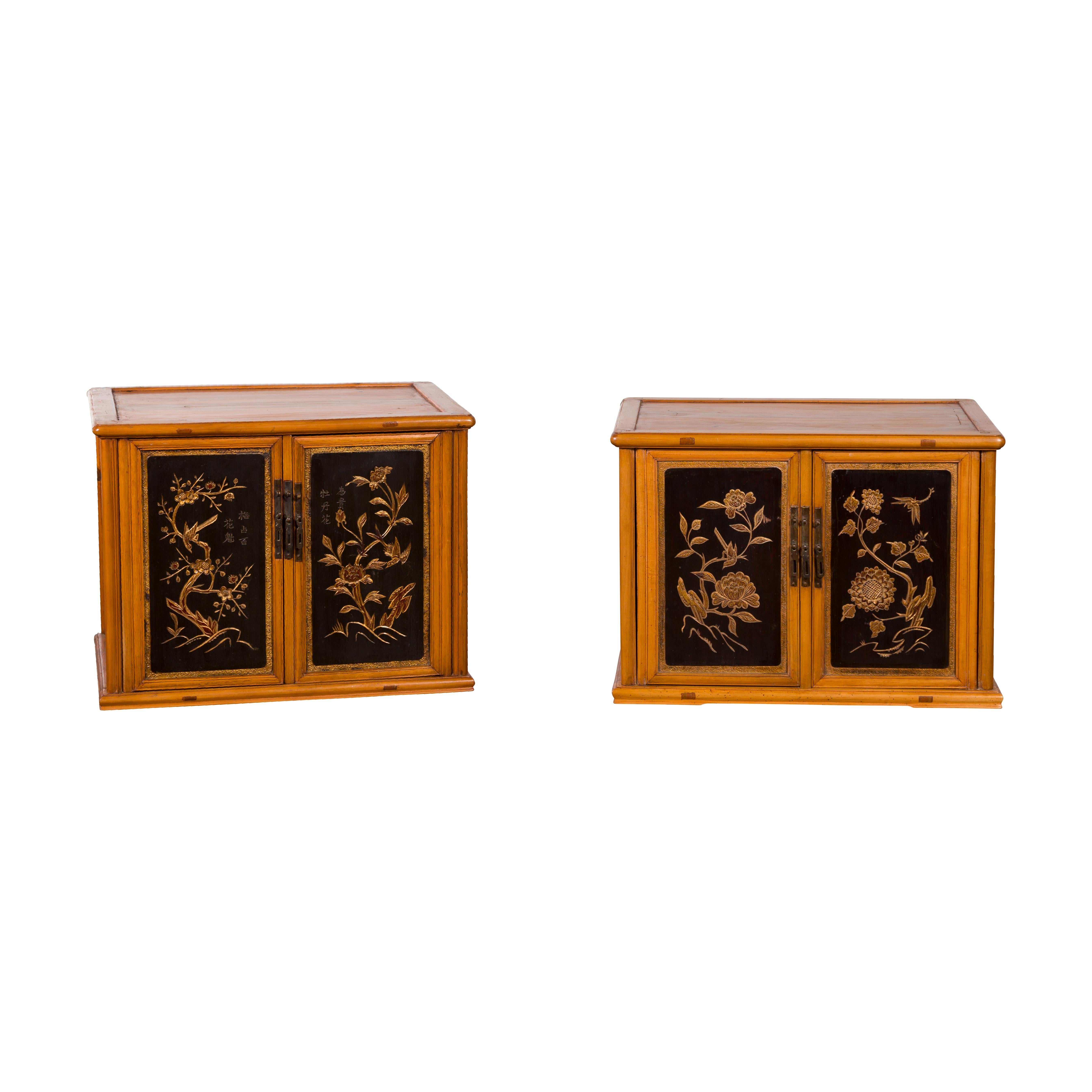 Two Chinese Qing Dynasty period fruitwood stackable side cabinets from the 19th century with carved gilt motifs, priced and sold $1,600 each. Created in China during the Qing Dynasty, each of these two cabinets features a rectangular top with