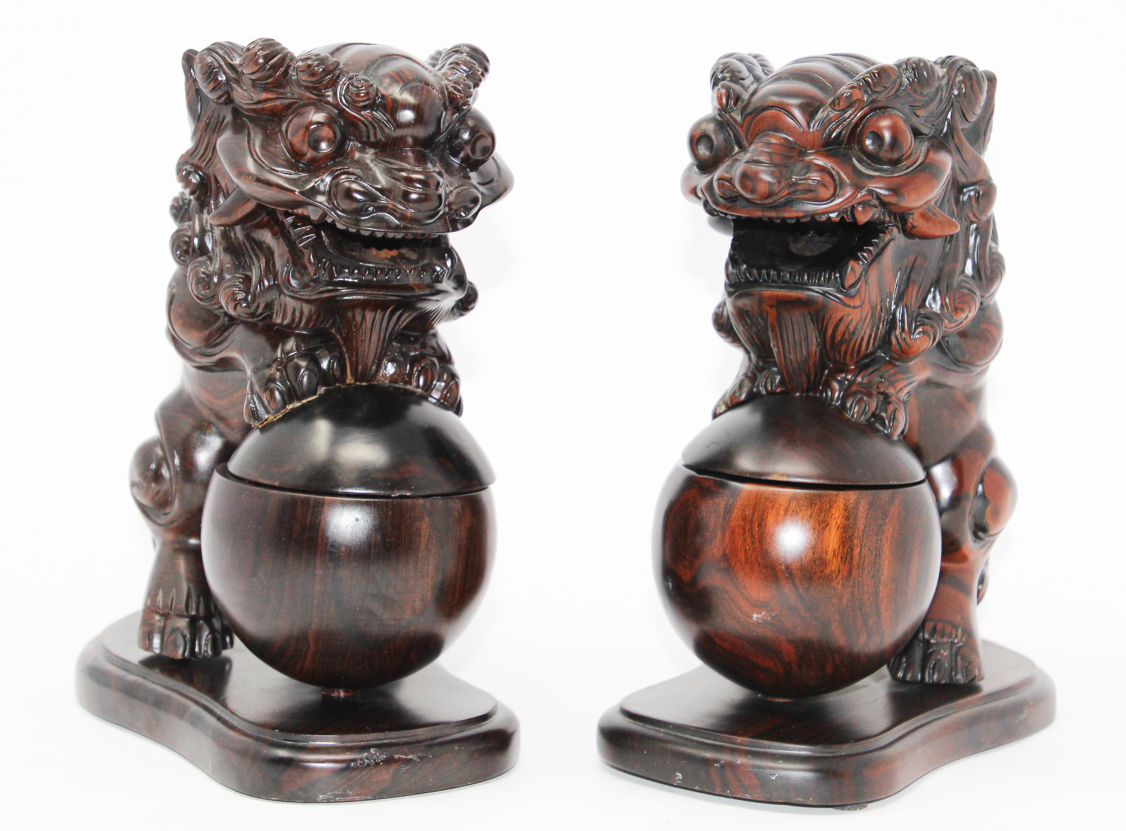 Two Chinese wood Foo Dogs Incense holder burners.
Featuring a pair of highly detailed lion foo dogs, one male and one female which were thought to protect the home from harmful spiritual influences and harmful people that might be a threat.
The