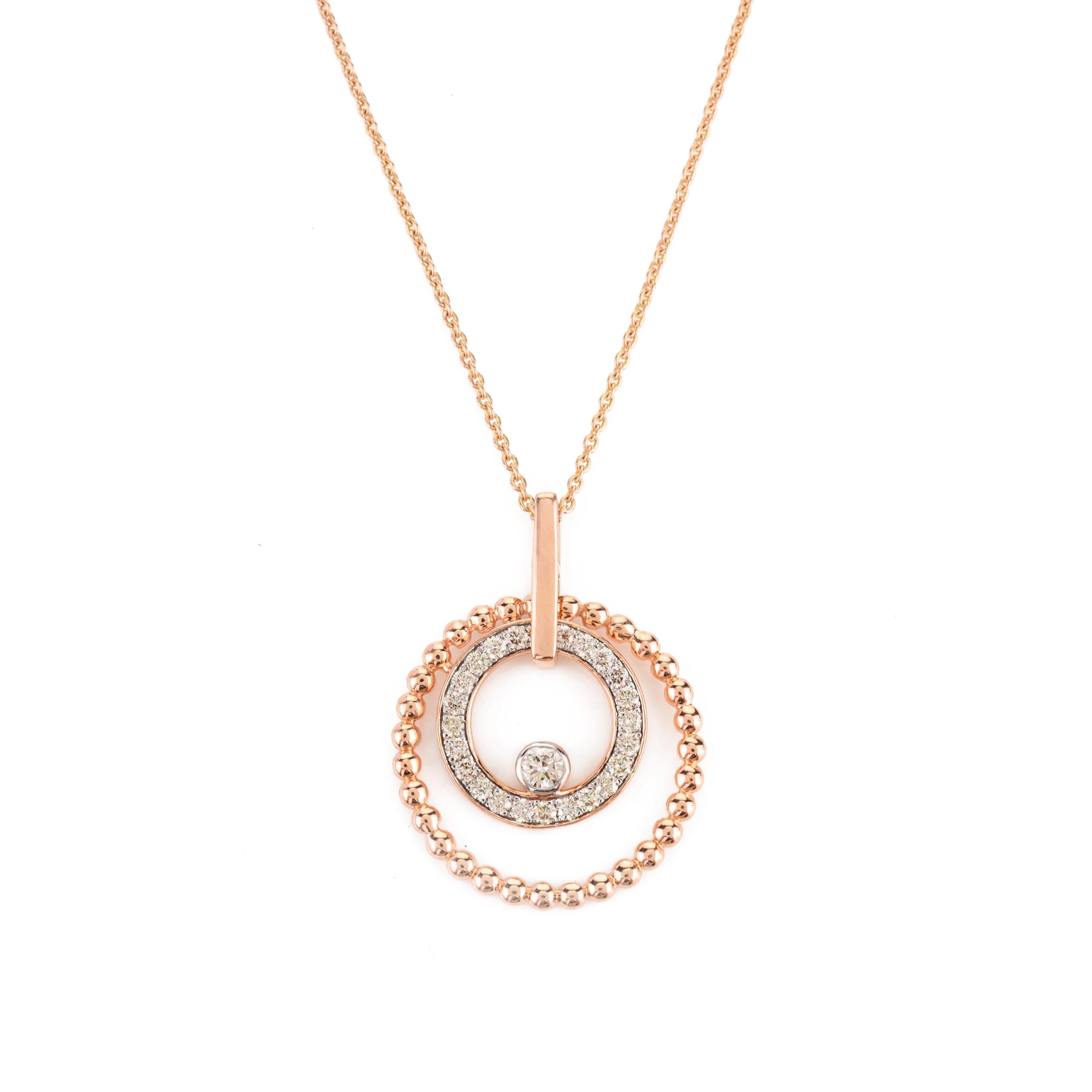Two Circle Spiral Diamond Pendant Necklace in 14K gold studded with round cut diamond. This stunning piece of jewelry instantly elevates a casual look or dressy outfit. 
April birthstone diamond brings love, fame, success and prosperity.
Designed