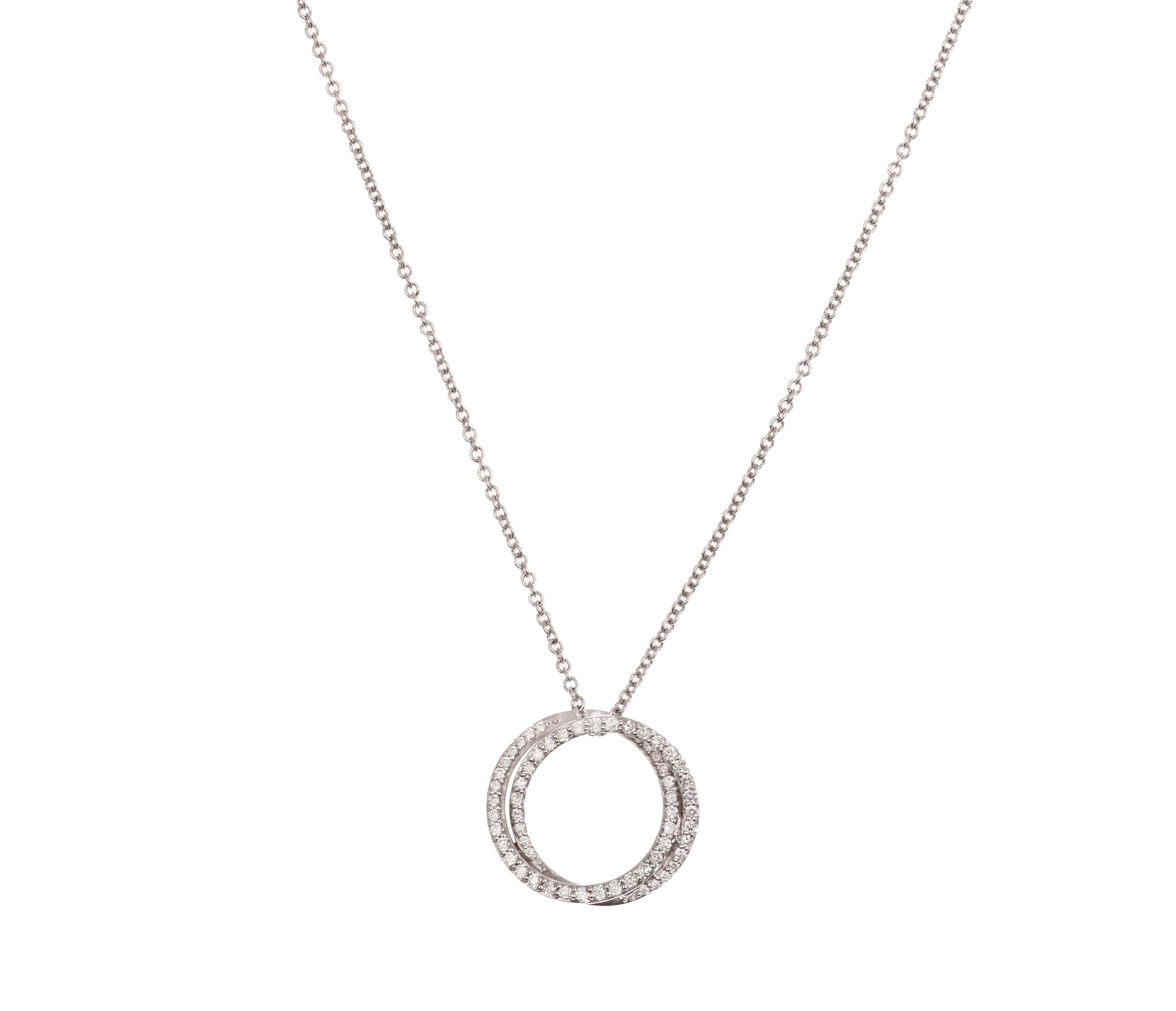 A fine and elegant necklace presenting a double circle paved with diamonds.

18K white gold 750 / 1000th (eagle’s head hallmark)

Diamonds weight 0.31 carats.

Diameter 17 mm

Length: 42 cm