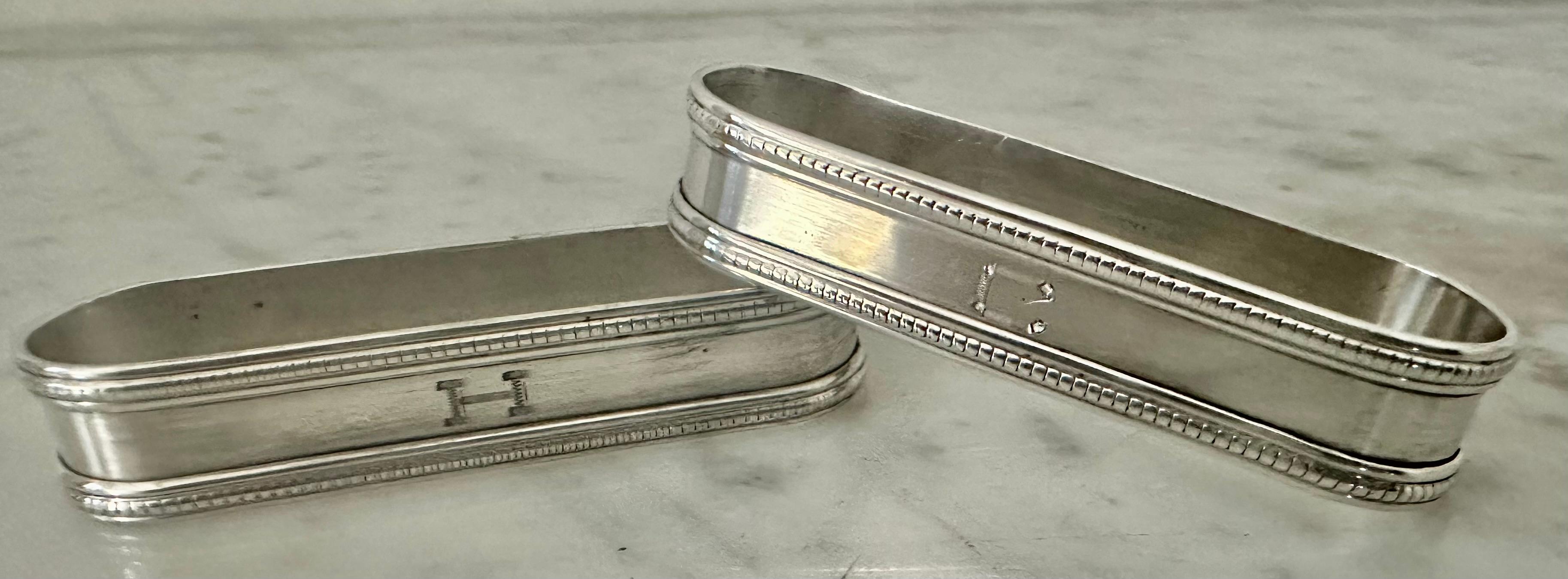 Elegant pair of oval Sterling napkin rings both stamped 
