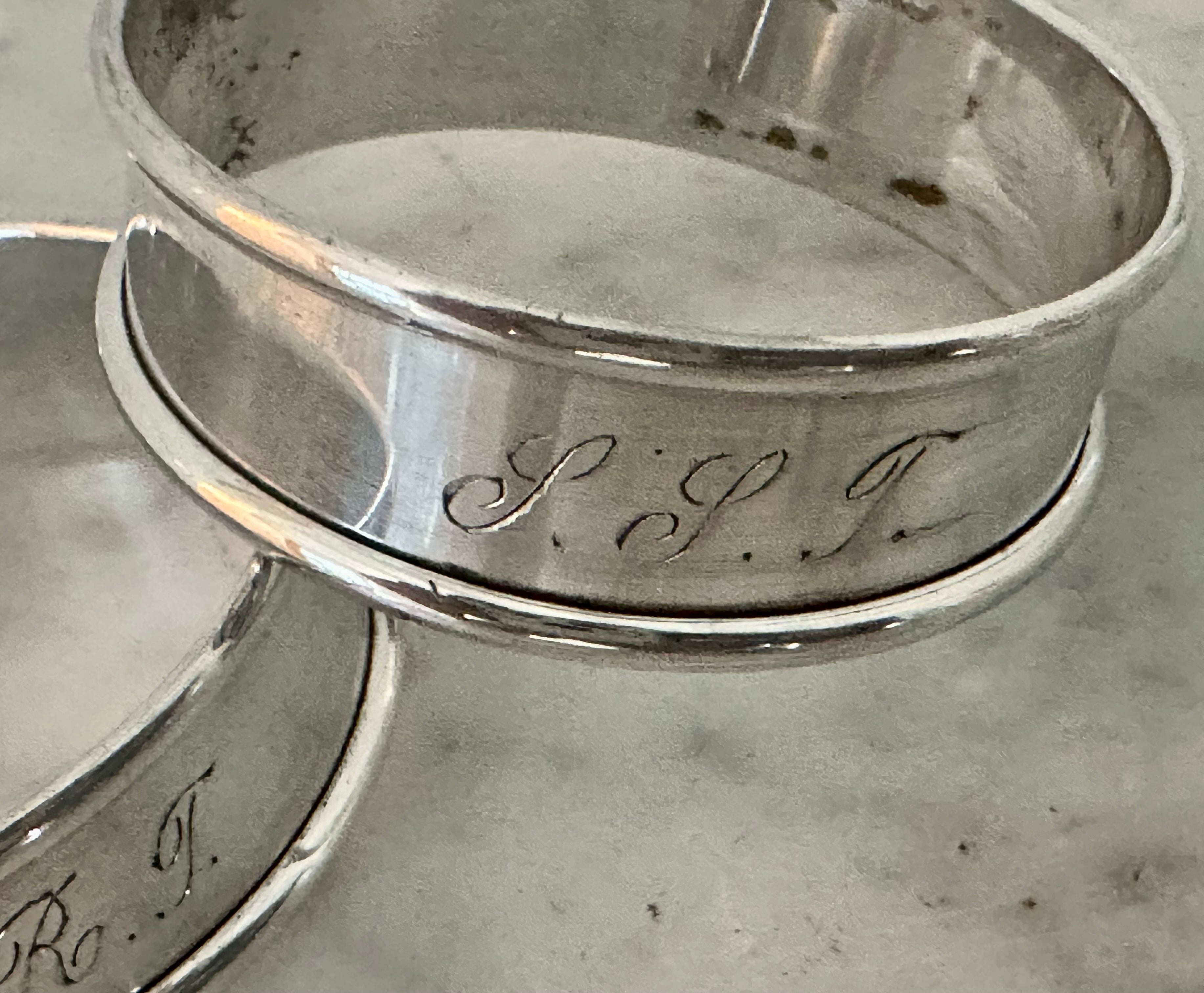 Elegant pair of round Sterling napkin rings both stamped 