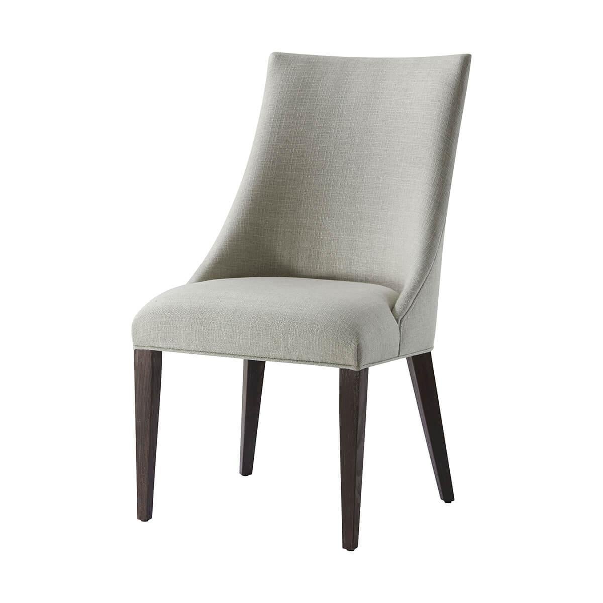 This beautifully designed chair combines classic style with modern functionality, making it a versatile addition to any interior. It features a scoop back and a tight seat cushion, all upholstered in a durable performance fabric, which offers both