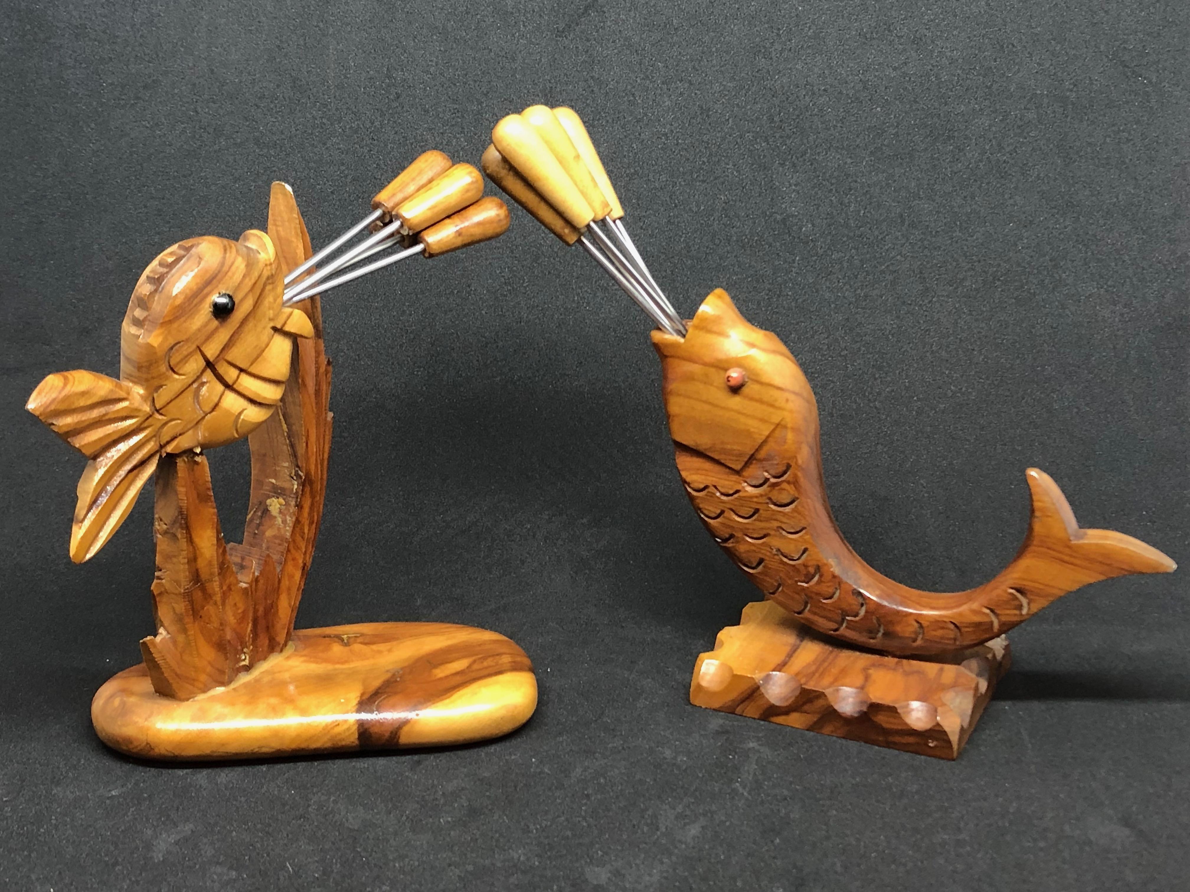 Classic early 1970s Italian design olive tree wood cocktail pick set of two in the form of a Fish. Nice addition to your room or just for your collection of design items. Made of olive tree wood and metal. They have glass eyes. Found at an estate
