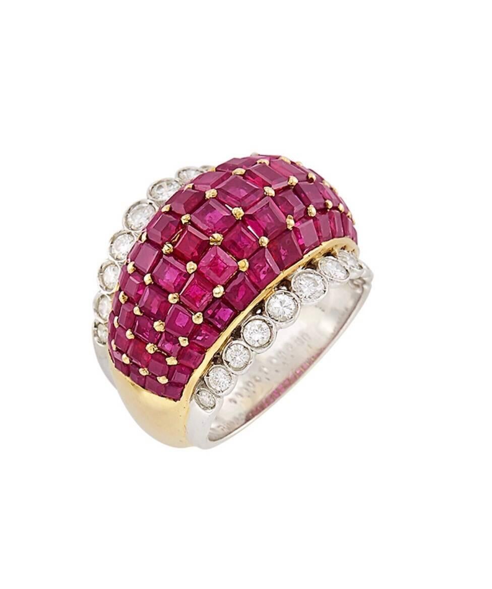 18 kt. yellow & white gold, 75 square-cut rubies ap. 7.00 cts., 22 round & single-cut diamonds ap. .95 ct., ap. 9.4 dwts.

Size 6. 

Rubies: medium deep raspberry, well-matched

Color: H-I

Clarity: VS. 