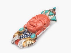 Two Colored Gold Buddha Clip Brooch with Coral, Turquoise, Sapphire and Diamonds