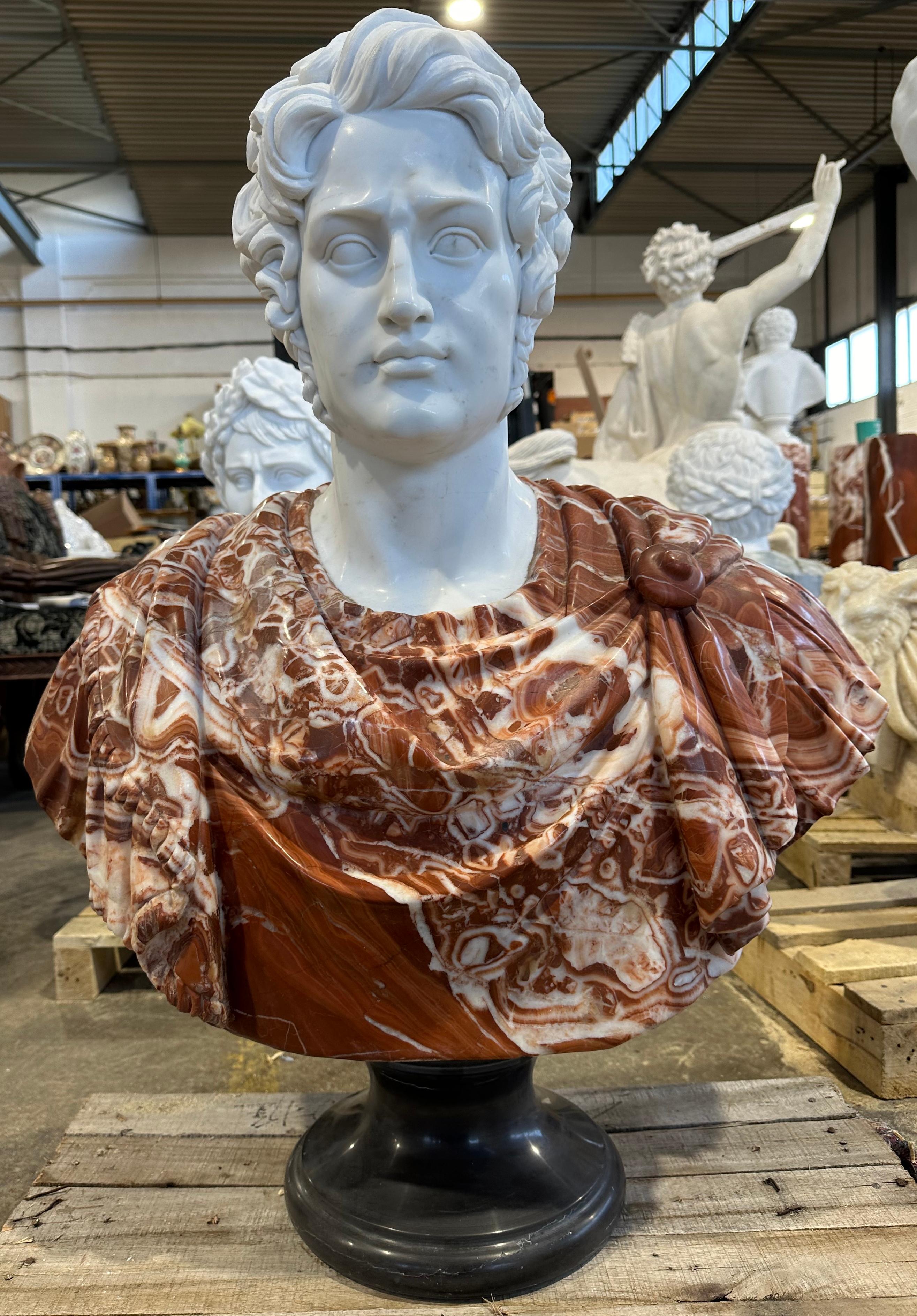 A highly decorative bust in two marble colours in the classical style. Skilfully carved with clean features, from the ruffled and curled hair to the drapery of the cloth garments. This bust would look superb as a centrepiece on a table in any room