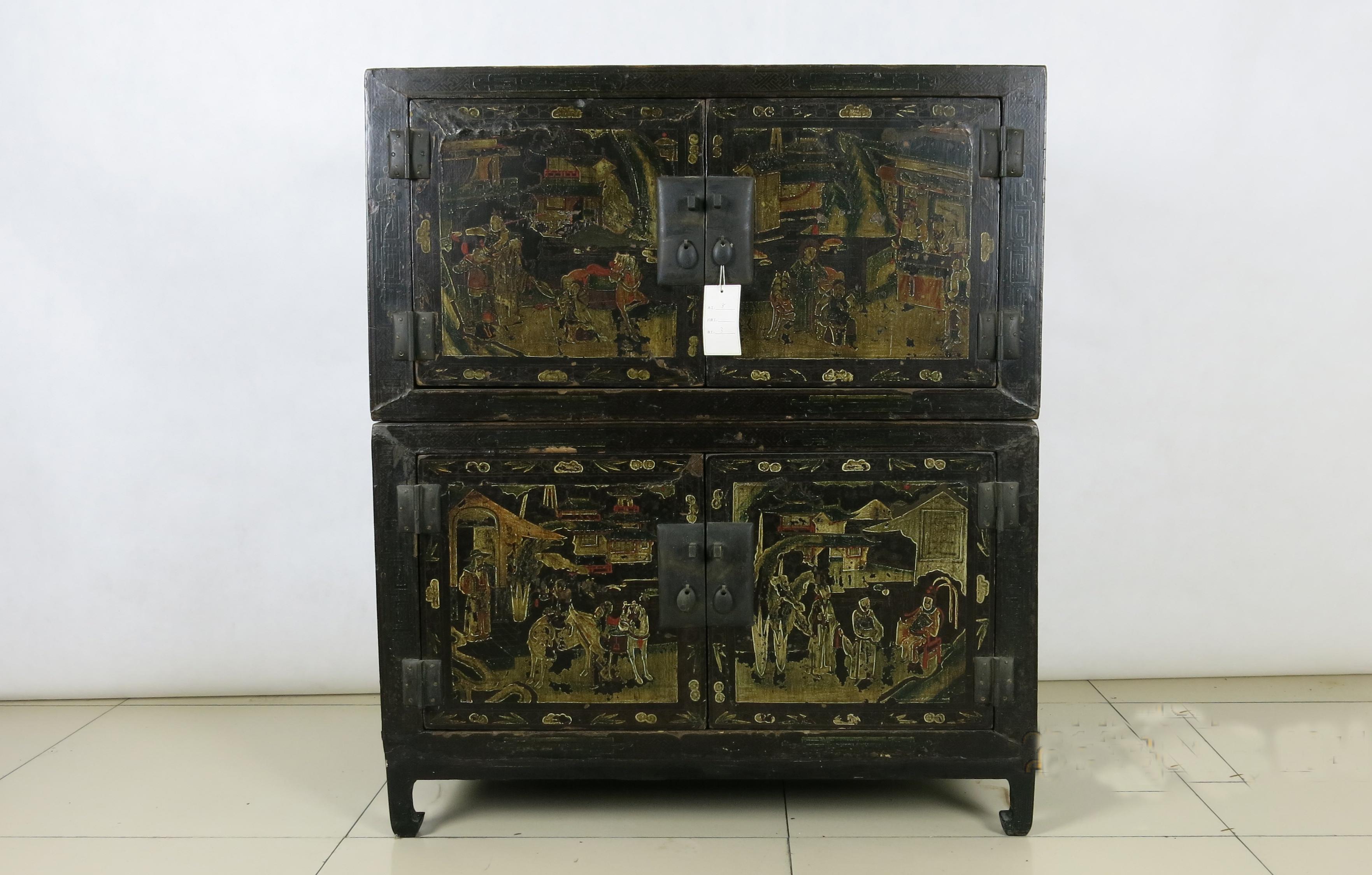 This black lacquer with gilt paint doors is a cabinet made of two separate cabinets. The lower cabinet has four carved horse hoof legs. The top cabinet can be placed on the top of the lower cabinet or used as a separate accent table. No matter how