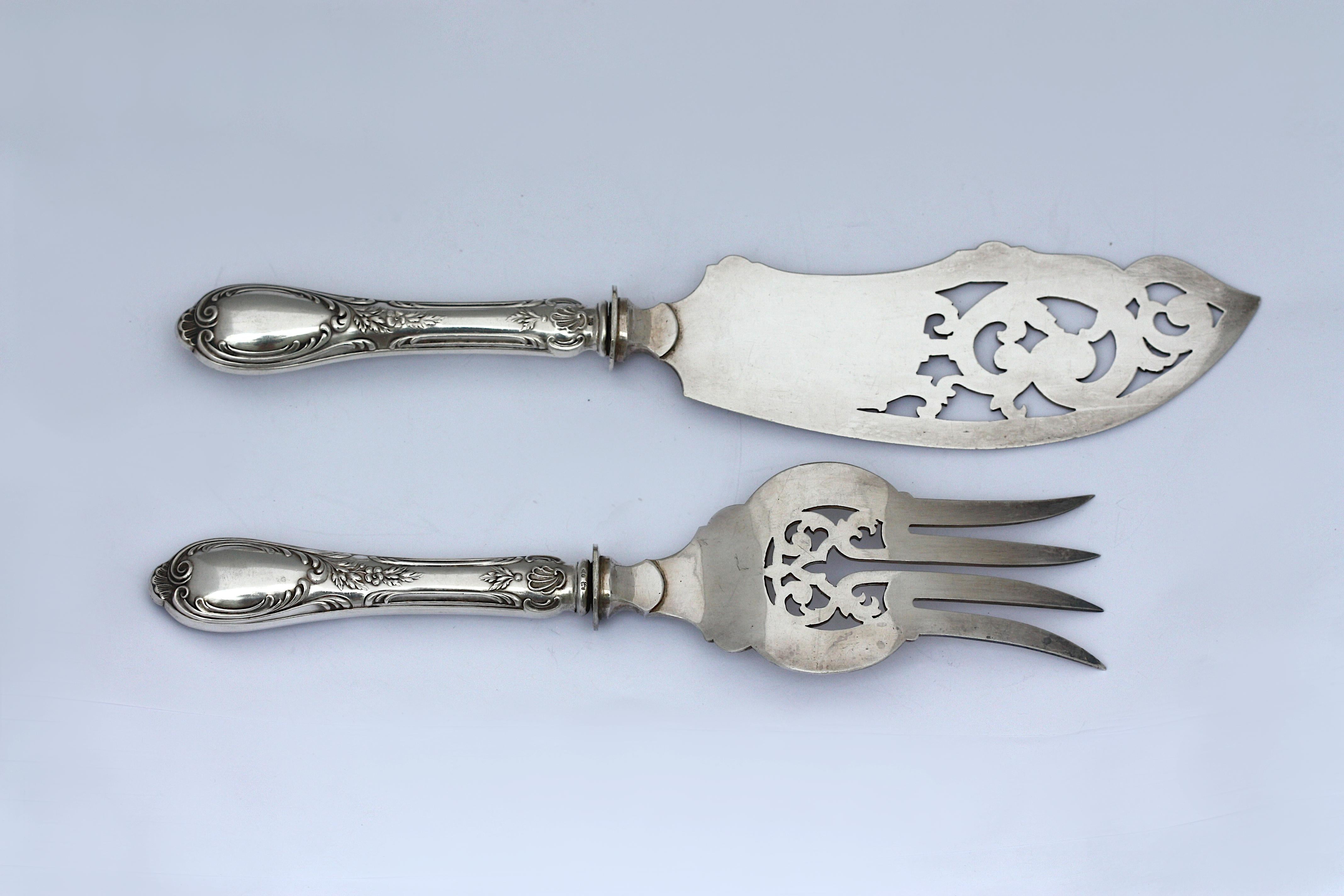 
Two Continental Silver Serving Pieces
Late 19th Century, marked 800 and with an indistinct additional mark. Comprising a fish slice, and a fish fork, chased with foliage and leaves.
Lengths 11 in. (27.94 cm.), 9.5 in. (24.13 cm.)