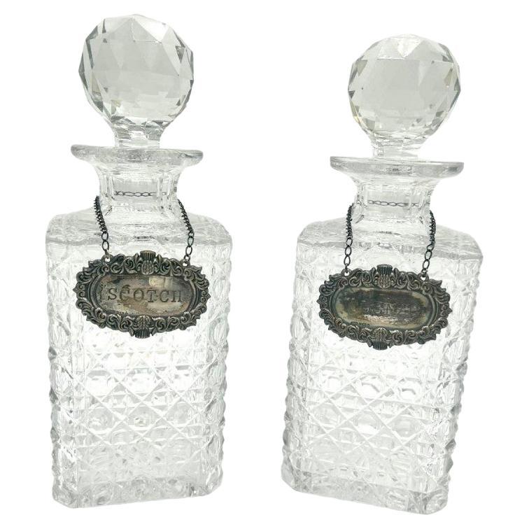 Two Crystal Decanters with a Silver Emblem, England, 1980s