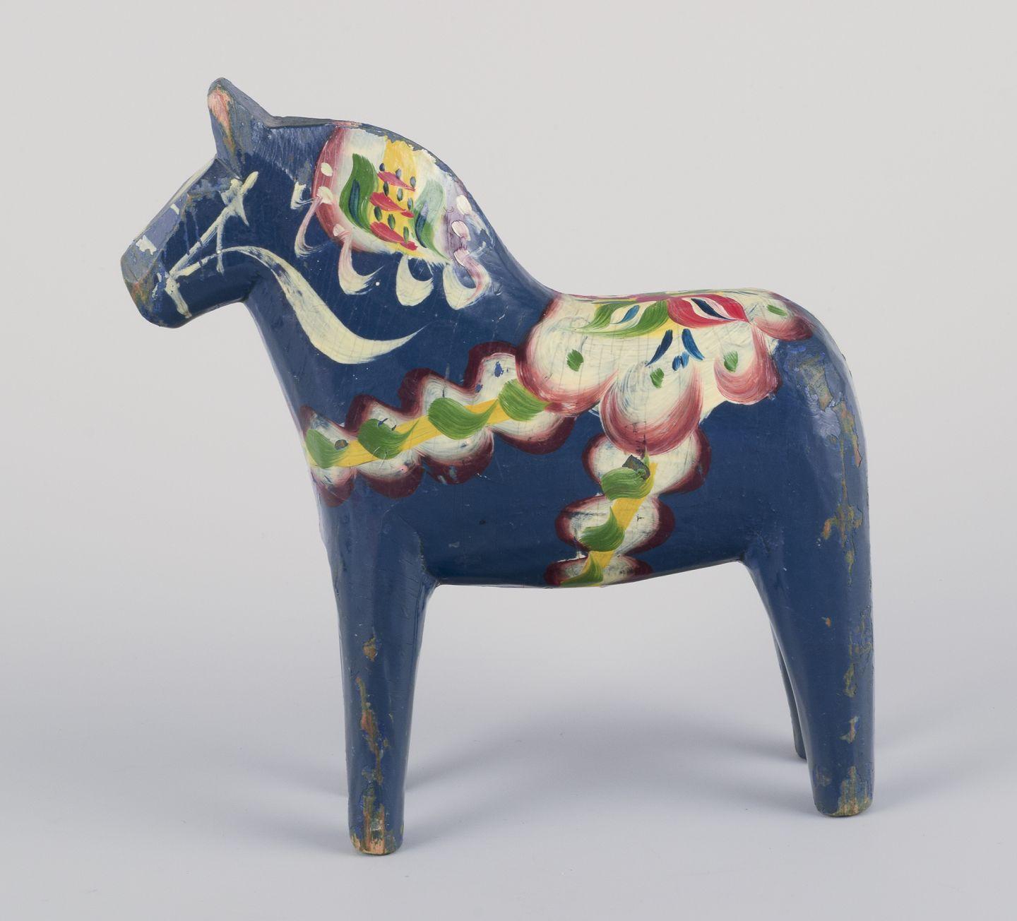 Swedish Two Dala horses. Hand-painted with floral motifs on a blue background. Folk art. For Sale