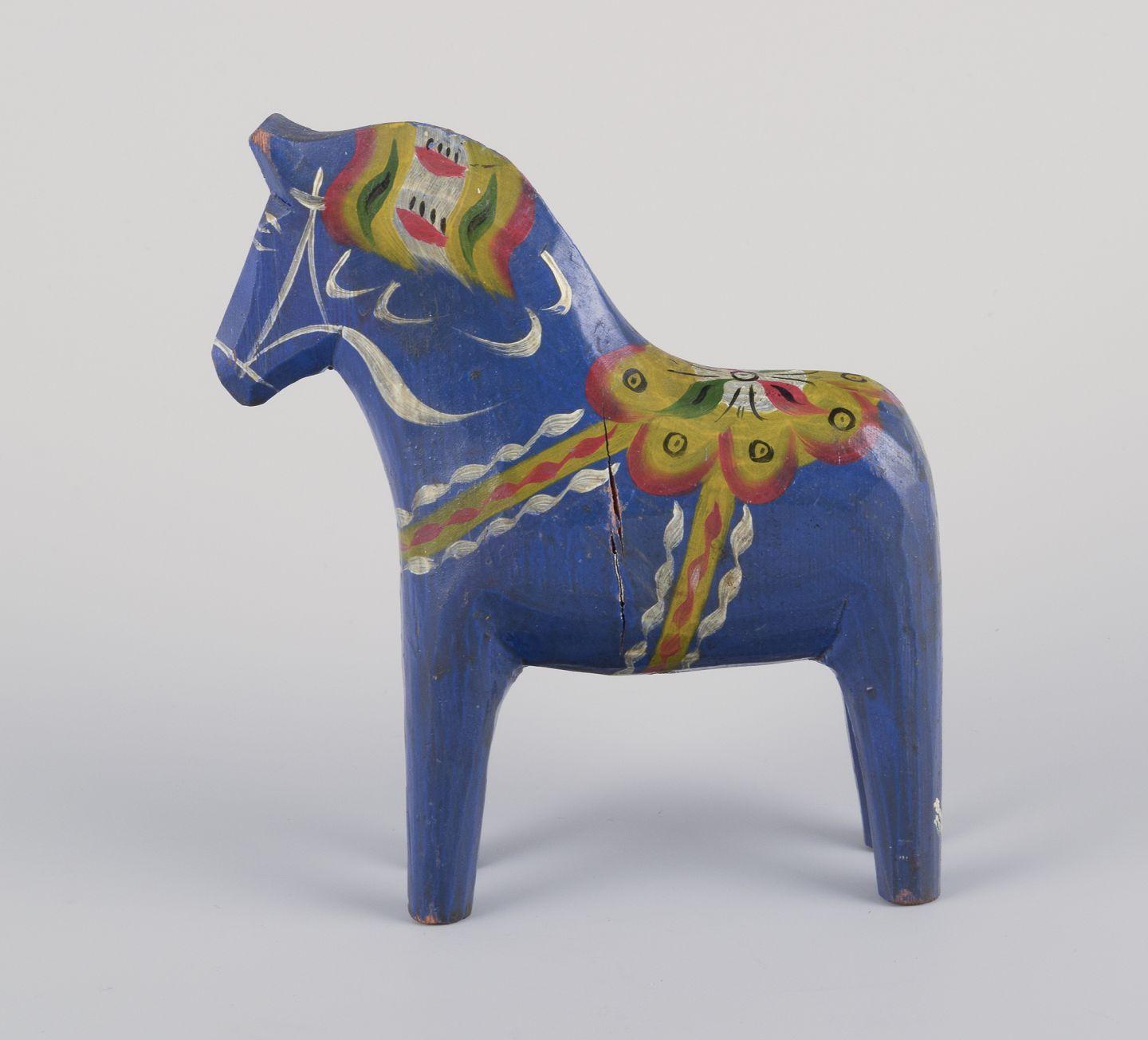 Hand-Carved Two Dala horses. Hand-painted with floral motifs on a blue background. Folk art. For Sale