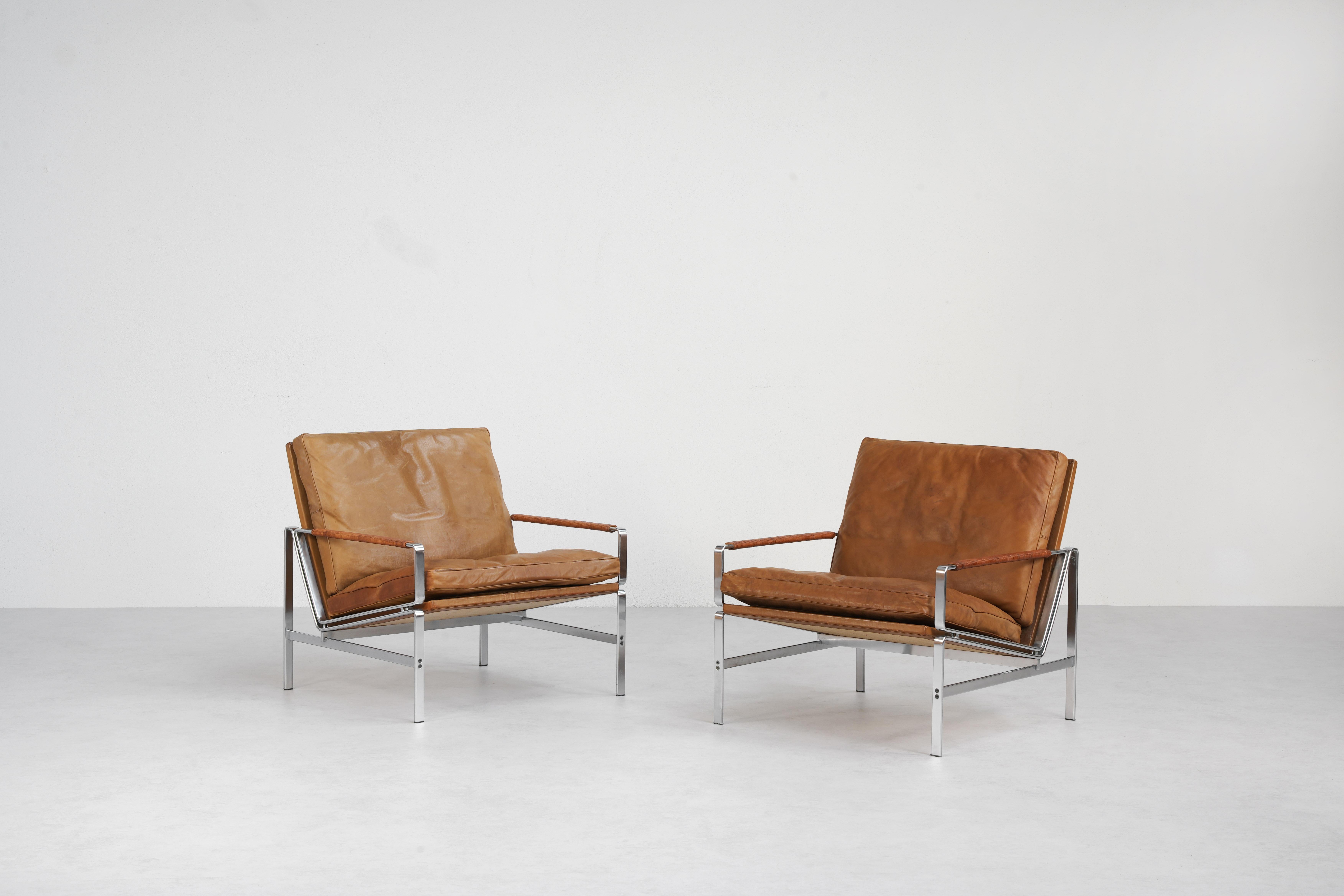 A beautiful pair of lounge chairs designed by Preben Fabricius & Jørgen Kastholm and produced by Alfred Kill International, Germany 1968. 
Designed with mid-century modern elegance, these chairs effortlessly combine form and function. Both chairs