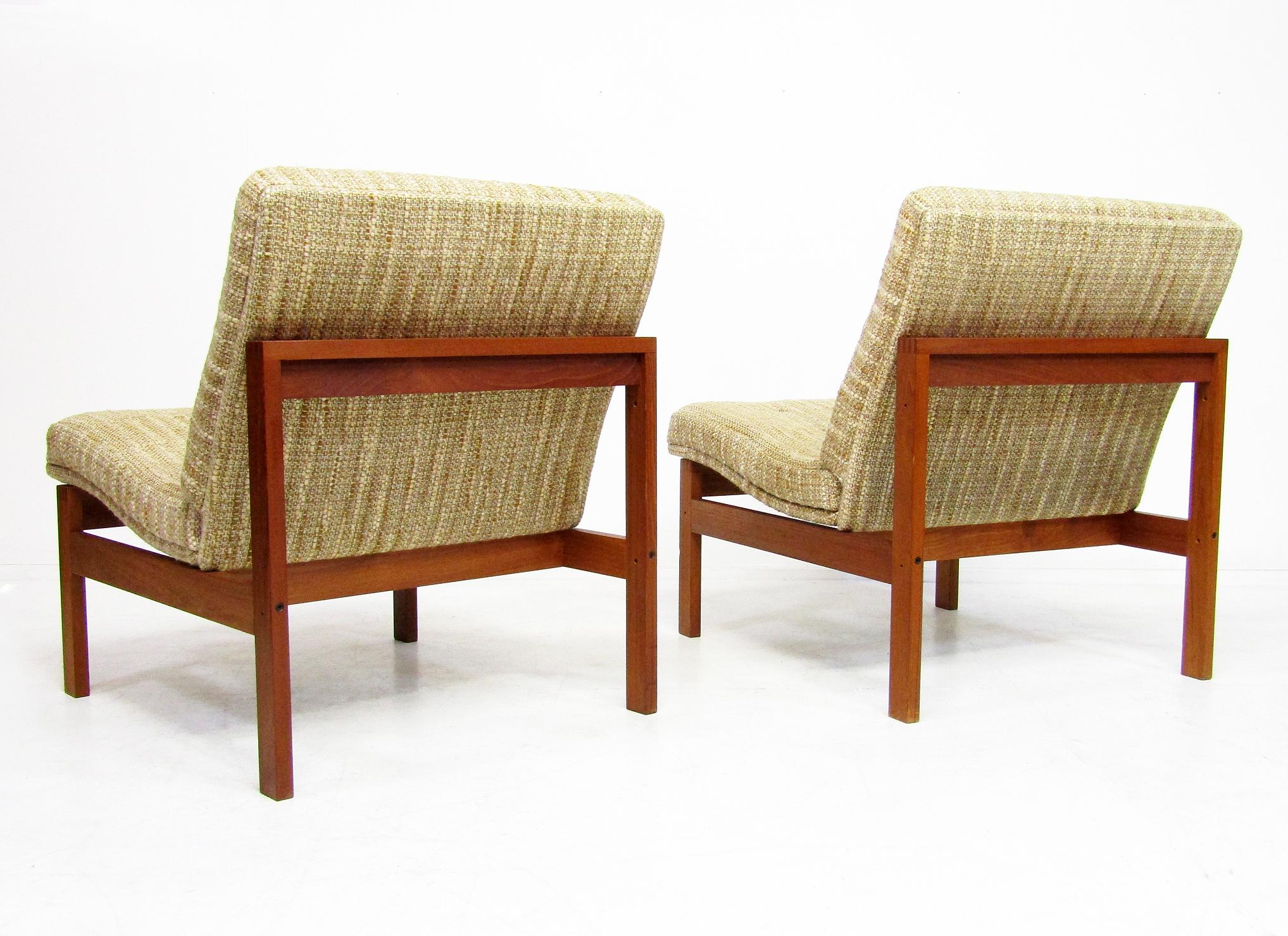 A pair of Danish lounge chairs by Ole Knudsen for France & Son, circa 1970.

The teak frames are beautifully constructed with finger joints. The fabric is the original soft, thick wool. 
 
They are in very good vintage condition. The frames are