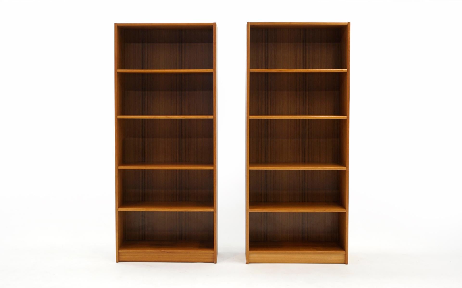 Pair of mid century Danish modern teak bookcases. Price is for each. Both are in very good condition with few signs of wear. There are a few small blemishes that can be seen upon close inspection. Ready to use.