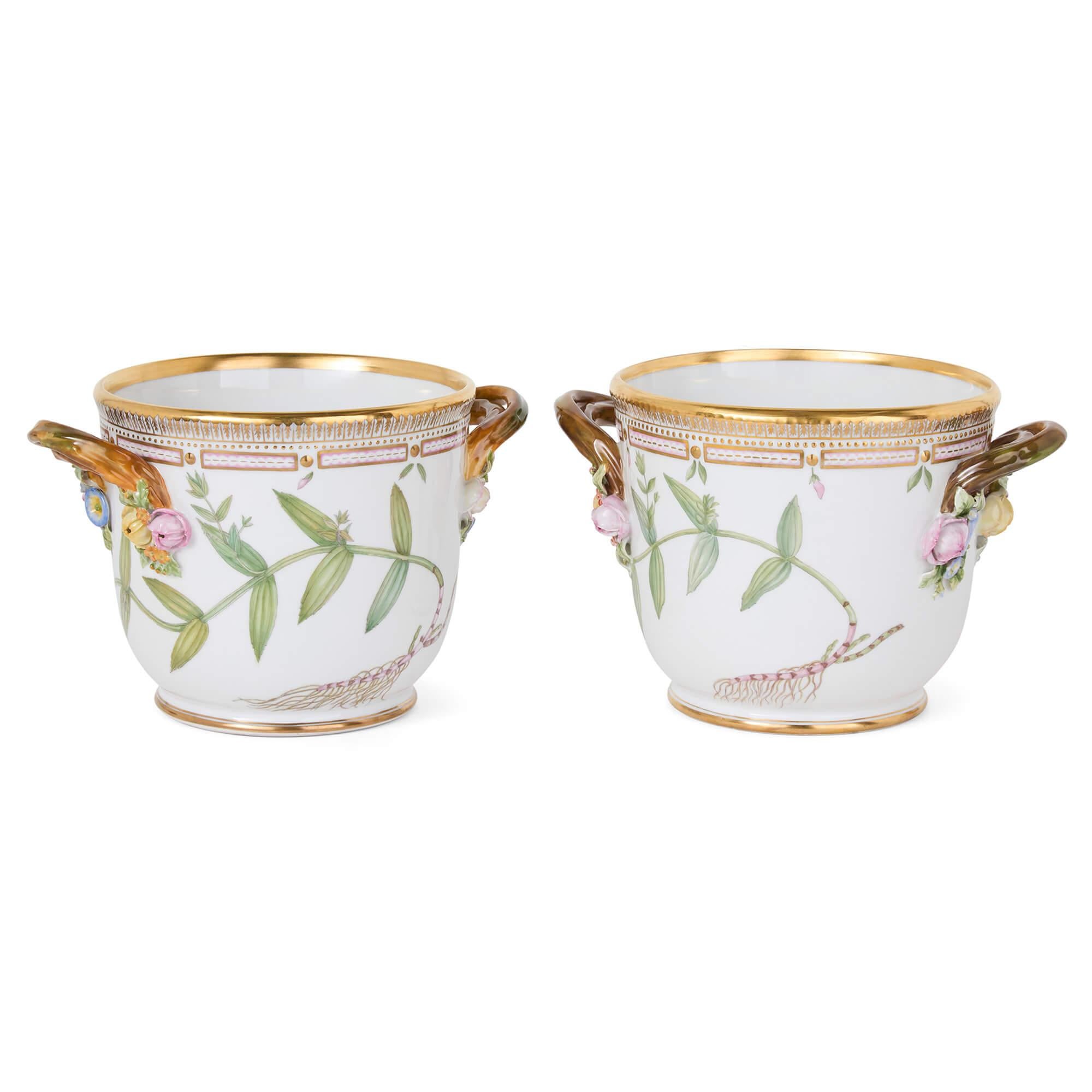 Two Danish Royal Copenhagen Flora Danica Porcelain Wine Coolers 
Danish, 20th Century 
Height 16cm, diameter 18cm

These 20th century wine coolers come from the Flora Danica dinner service by Royal Copenhagen. The esteemed Flora Danica service,