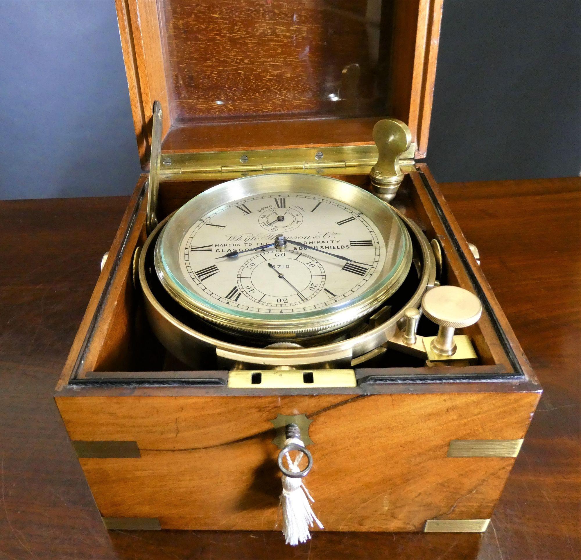 A fine two day Marine Chronometer By Whyte, Thompson & Co, Glasgow & South Shields
 
Two day marine chromometer by Whyte, Thompson & Co housed in a beautiful three tier mahogany brass bound box with inset carrying handles to the sides, plaque to