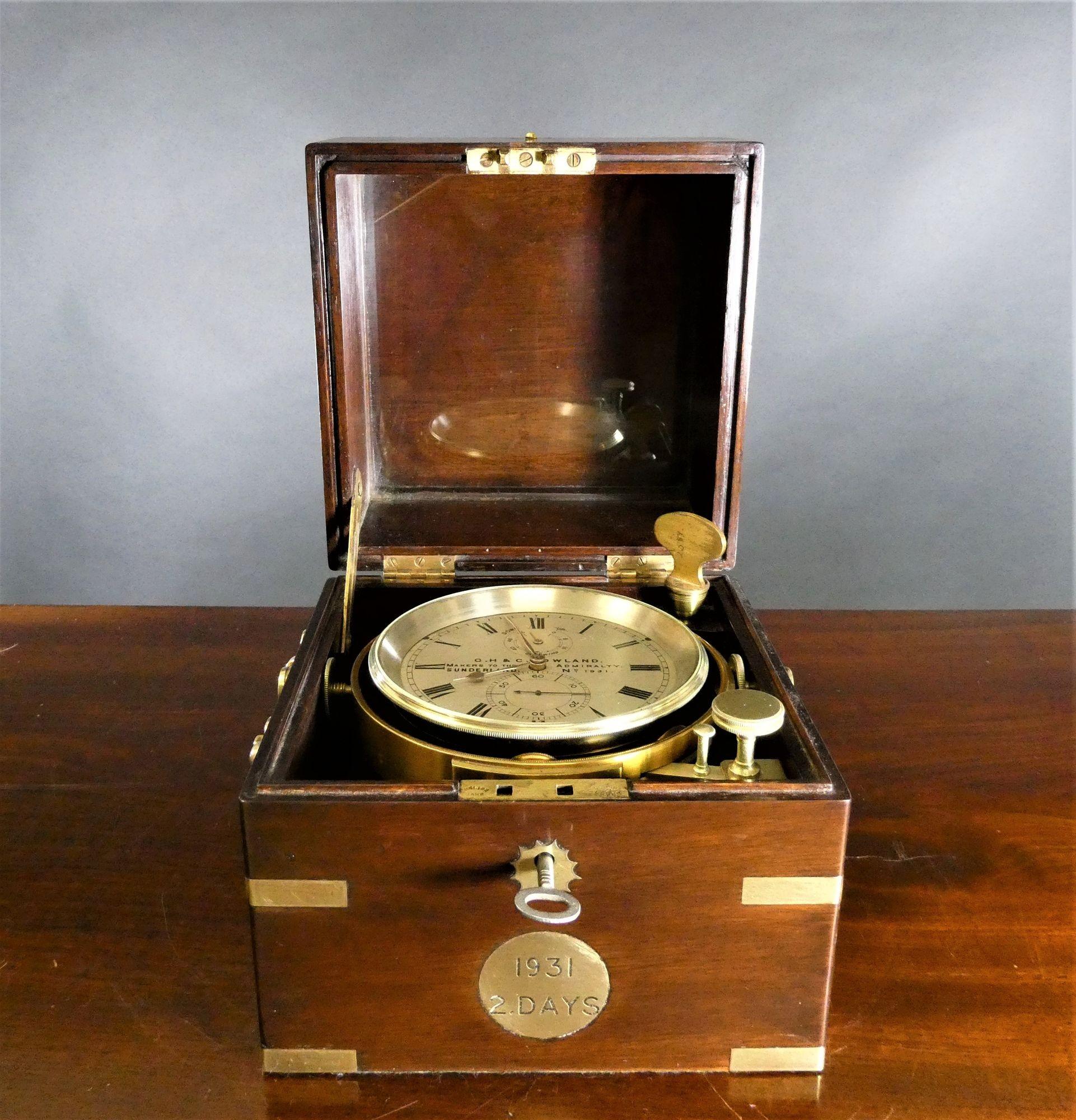 A fine two Day Marine Chronometer by G.H & C Gowland, Sunderland No. 1931
 
Two day marine chromometer by G.H & C Gowland housed in a beautiful three tier mahogany brass bound box with brass carrying handles to the sides, inset plaque to the front