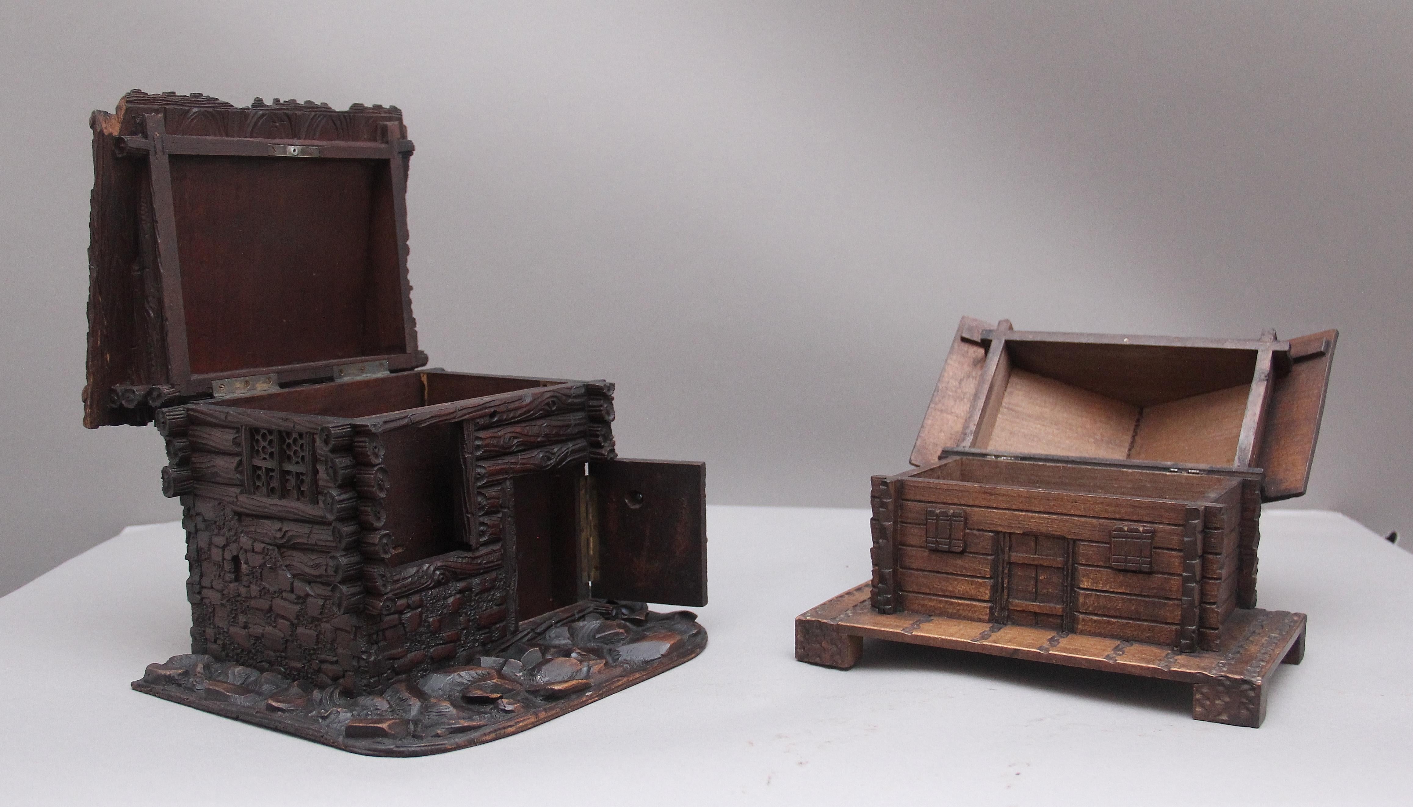 Two decorative 19th Century black forest cottages with each roof lifting up to reveal compartment space, both cottages are in very good condition. Circa 1880.