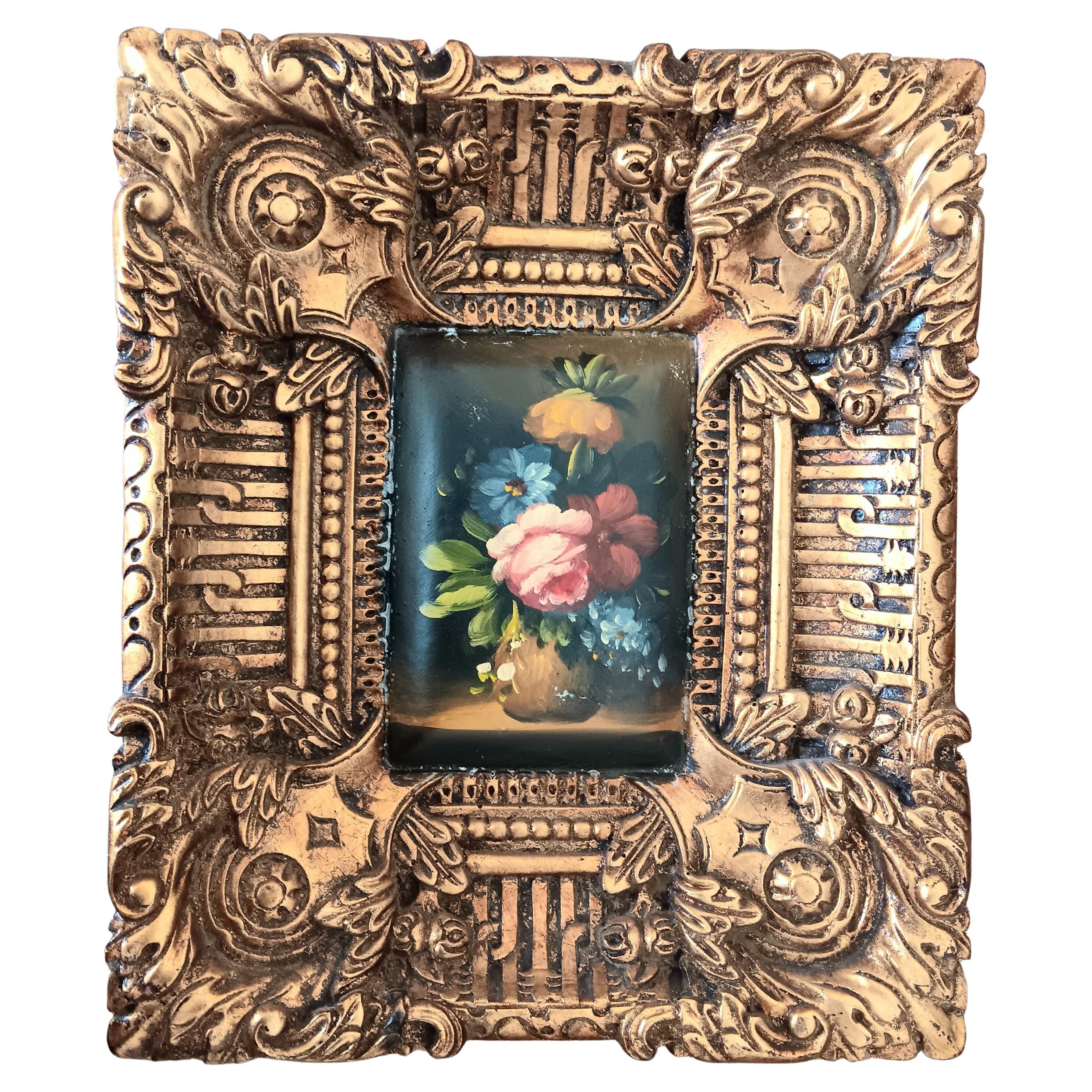 Two Decorative Golden Baroque Frames With a Bouquet of Flowers For Sale