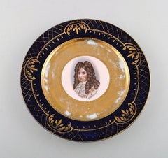 Two Decorative Plates in Hand Painted Porcelain with Gold Decoration, circa 1900