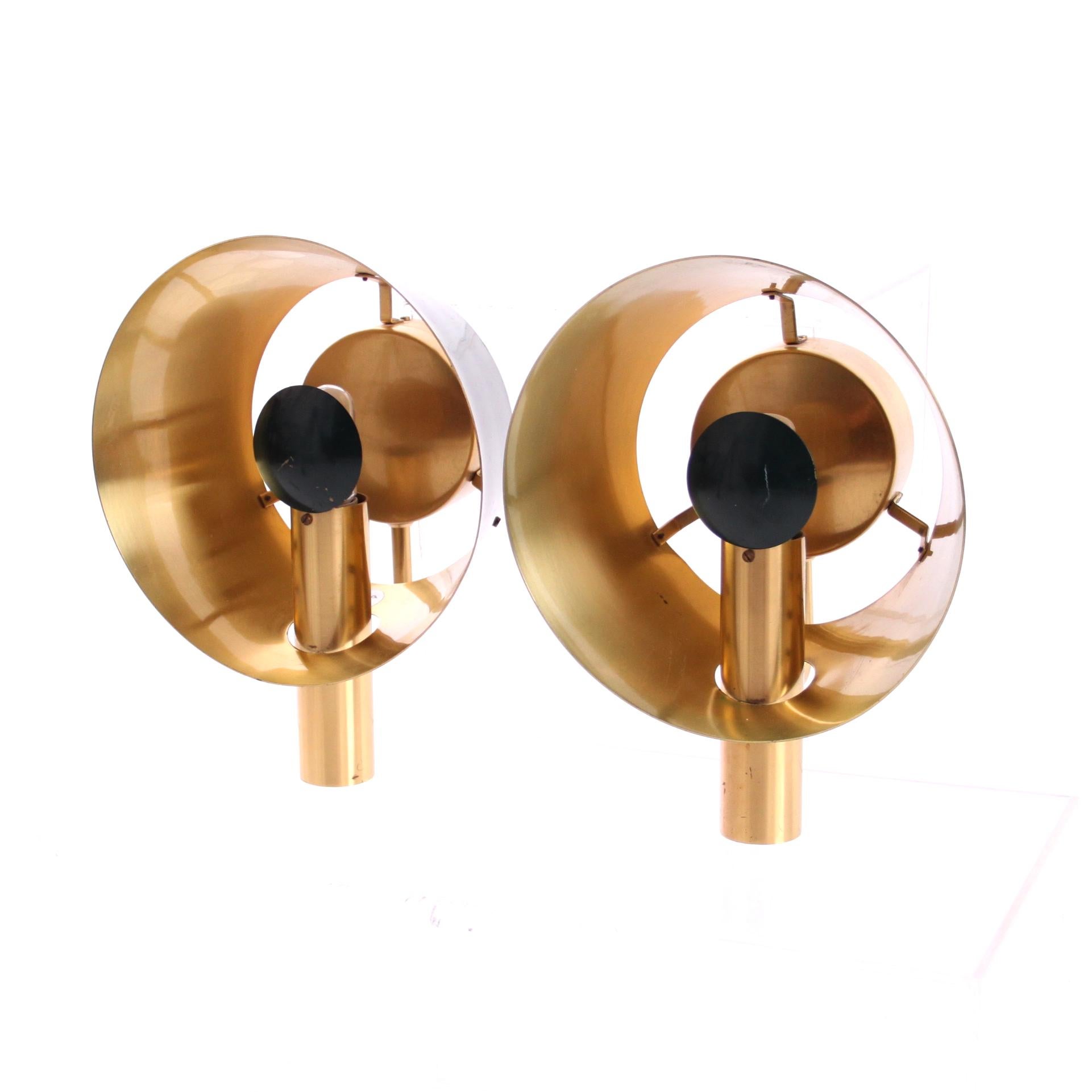 A pair of decorative wall lights by LYFA that project beautiful sculptural light on the wall. 

The lights are made of brass and green lacquered surfaces. They are manufactured by LYFA Denmark in the 1960s. 

LYFA is renowned for manufacturing
