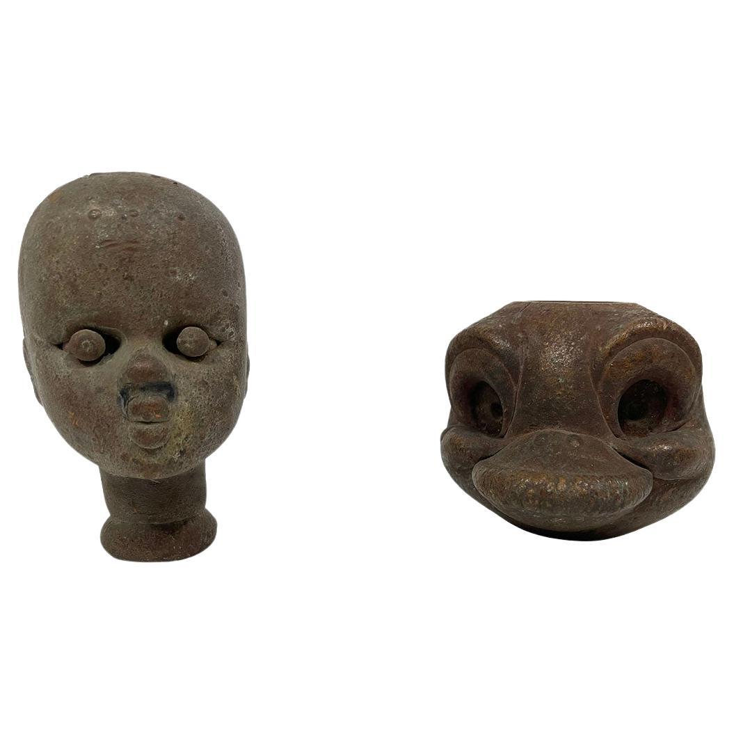 Two doll head molds from the mid-20th century