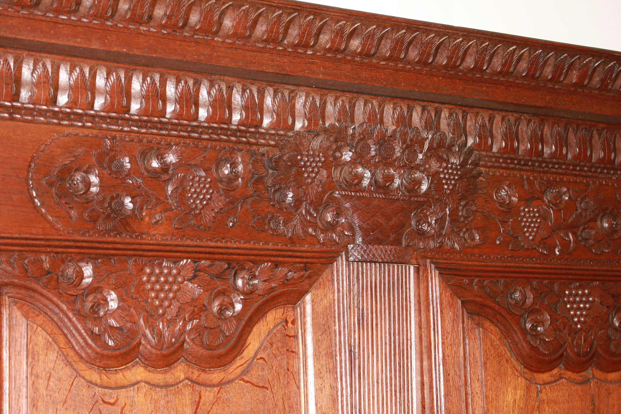 Rustic Two-Door Carved Normandy Wardrobe, France 18th Century For Sale