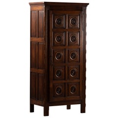 Two-Door Dark Oak Armoire with Carved Rosette Medallions, France, 1950s