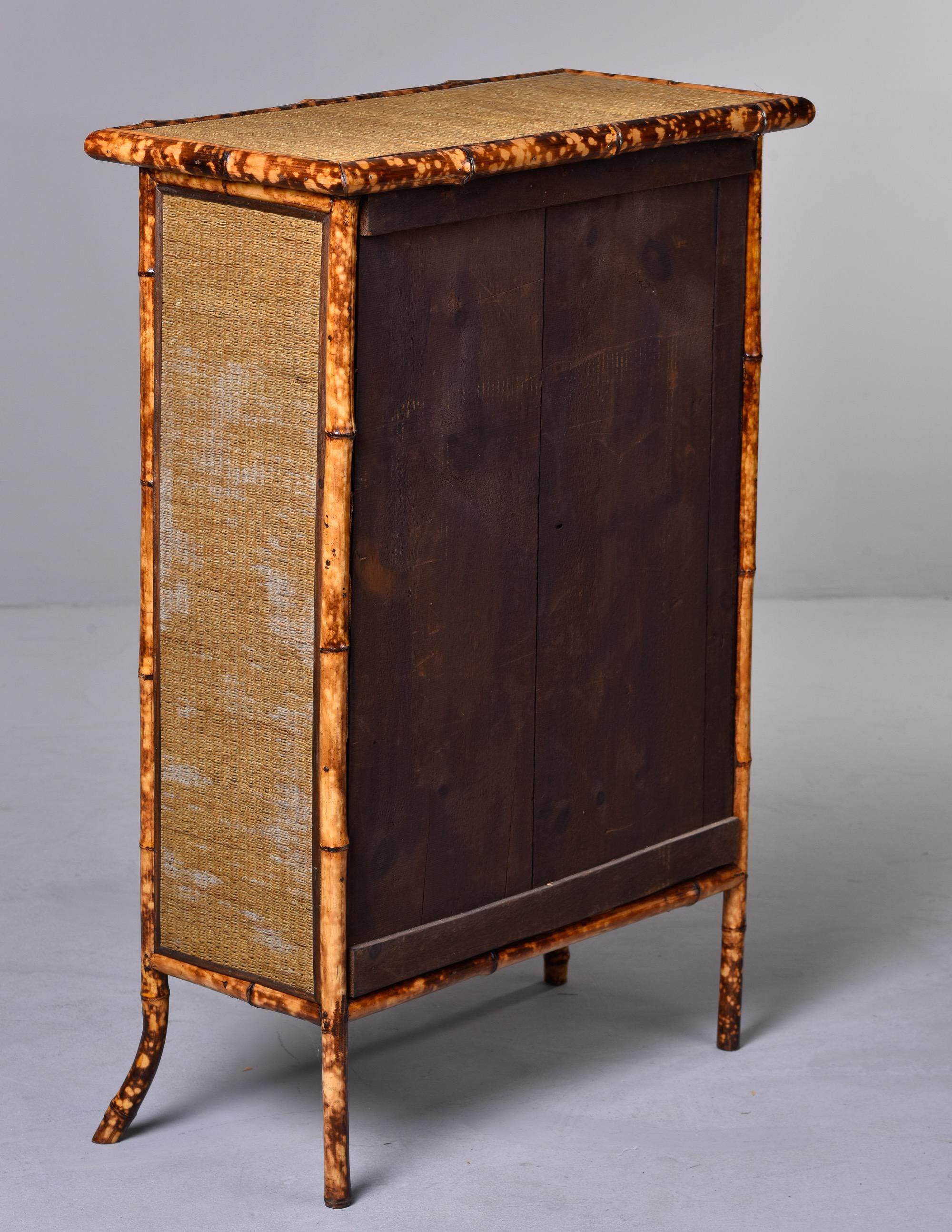 Two Door Glass Front Cabinet with Spotted Bamboo Frame 2