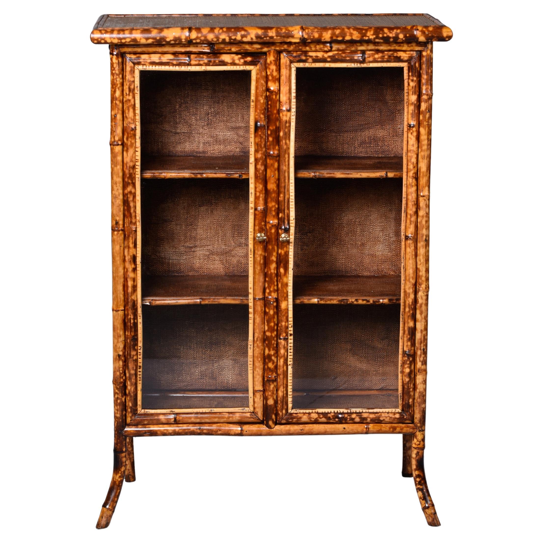 Two Door Glass Front Cabinet with Spotted Bamboo Frame