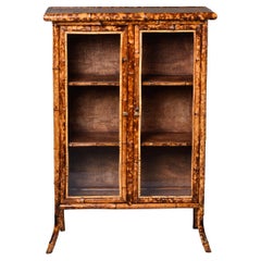 Two Door Glass Front Cabinet with Spotted Bamboo Frame