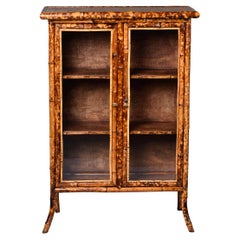 Two Door Glass Front Cabinet with Spotted Bamboo Frame