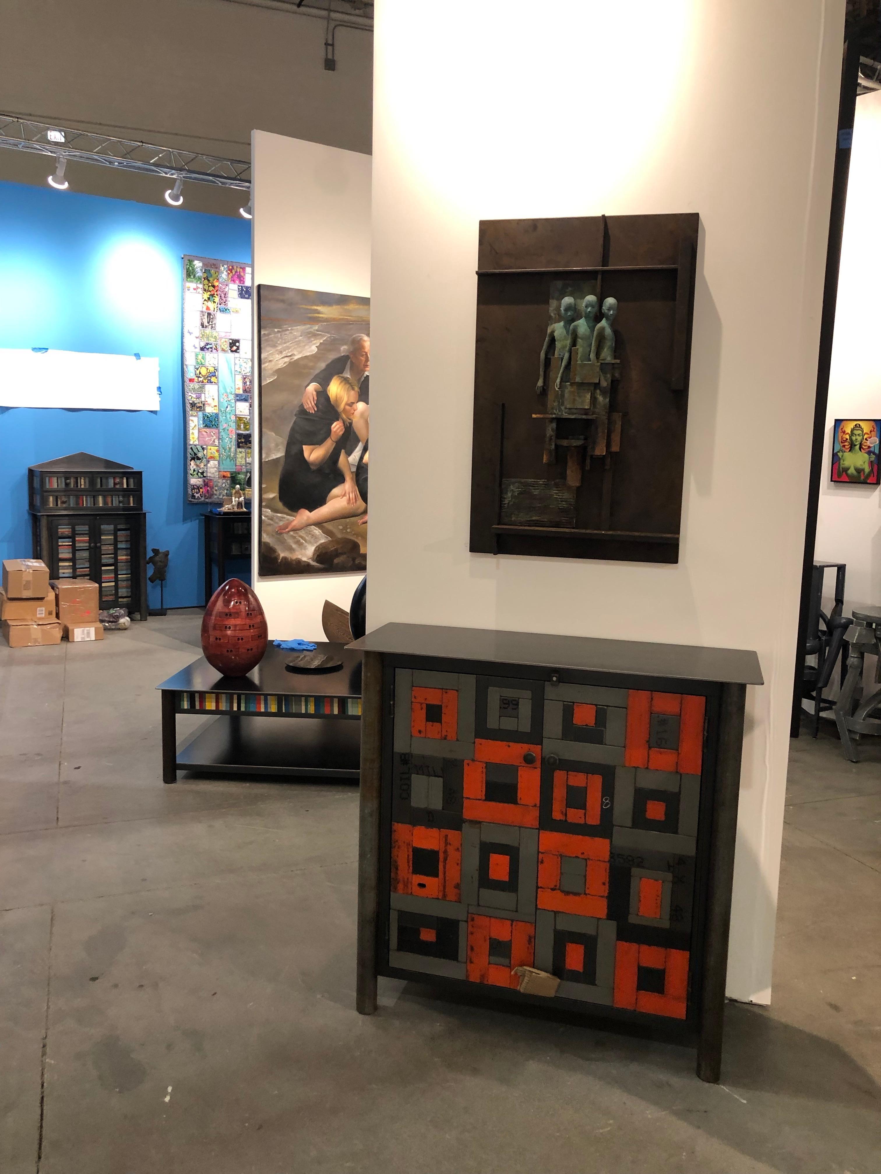 This totally functional modern industrial cabinet is created from hot-rolled steel and found painted panels is the ultimate example of sustainable design.  The color is original to the steel and uses salvaged and recycled materials.  In this case,