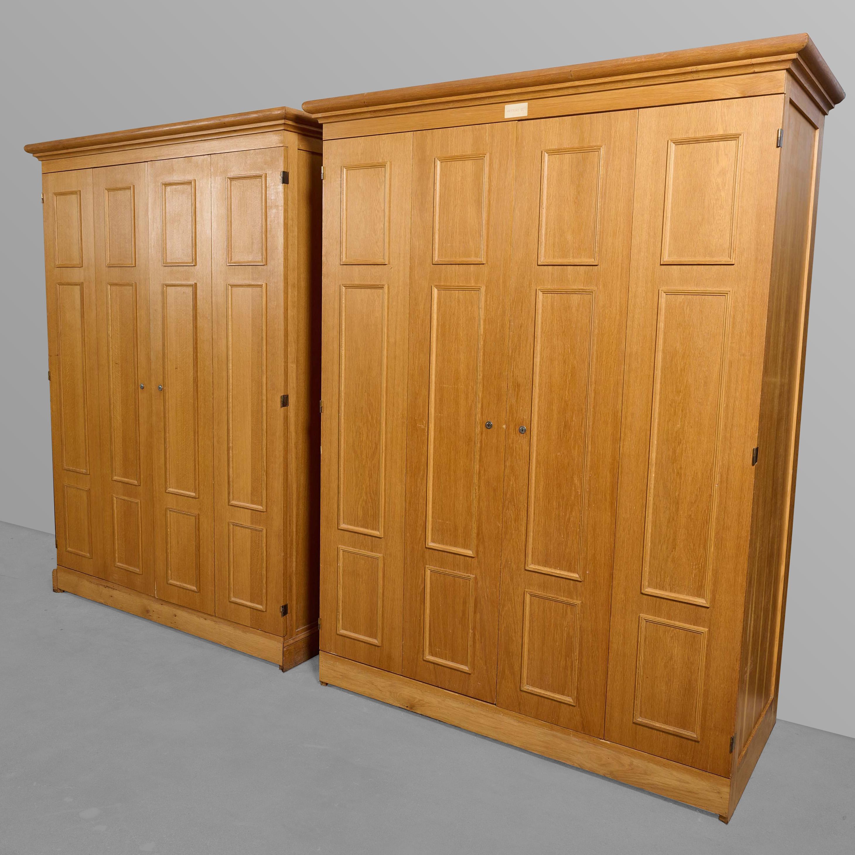 Two door oak cabinet with multi door interior. From the Bank of France. Two available, priced per single unit.

