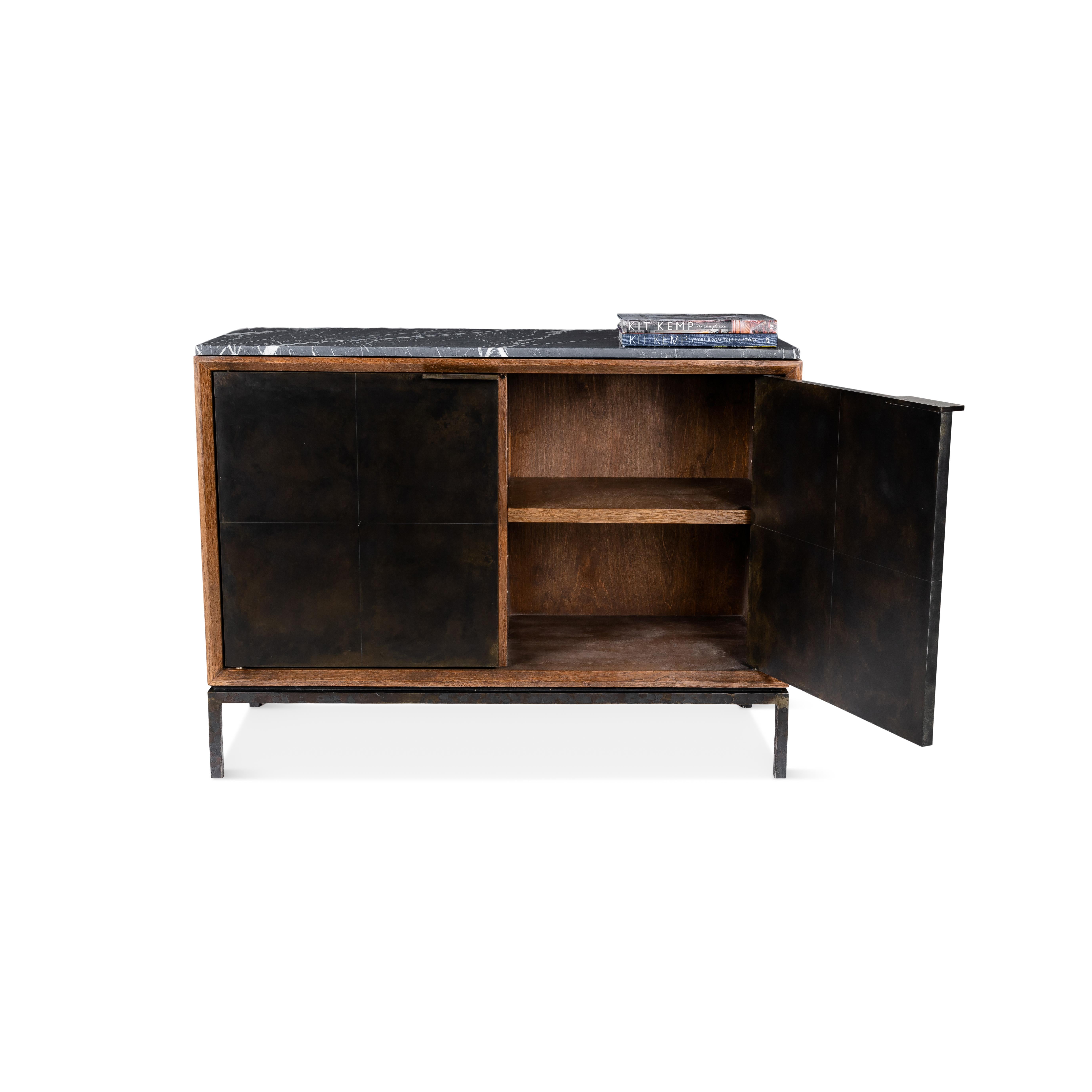 Server with two aged bronze zinc doors, wood body, and honed nero marquino top.

This item is crafted from natural materials. Coloring and detailing may vary, adding to its uniqueness.

Dimensions, stone type and metal finish can be