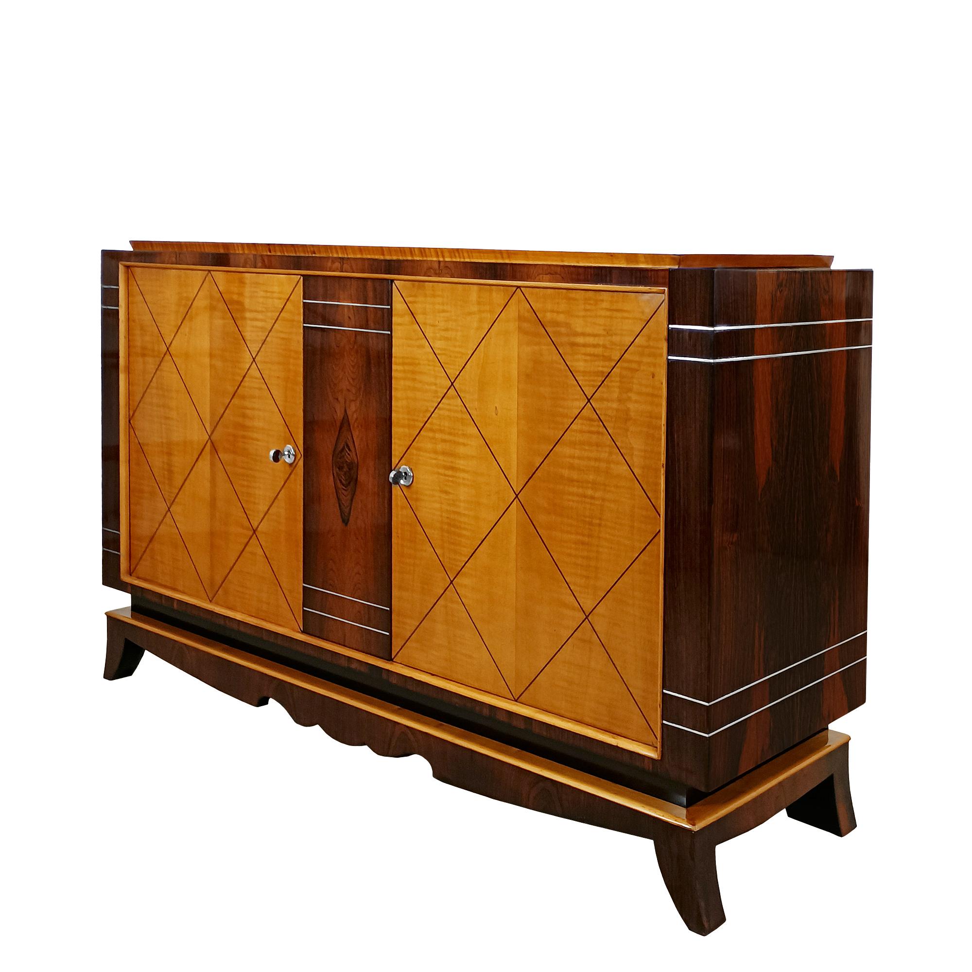 Two-doors sideboard in solid mahogany with Rio rosewood veneer throughout, and maple veneer with dark wood marquetry on the doors. Door frames and top of base in solid maple. Polished aluminium decorative rods. Interior shelves with mahogany veneer