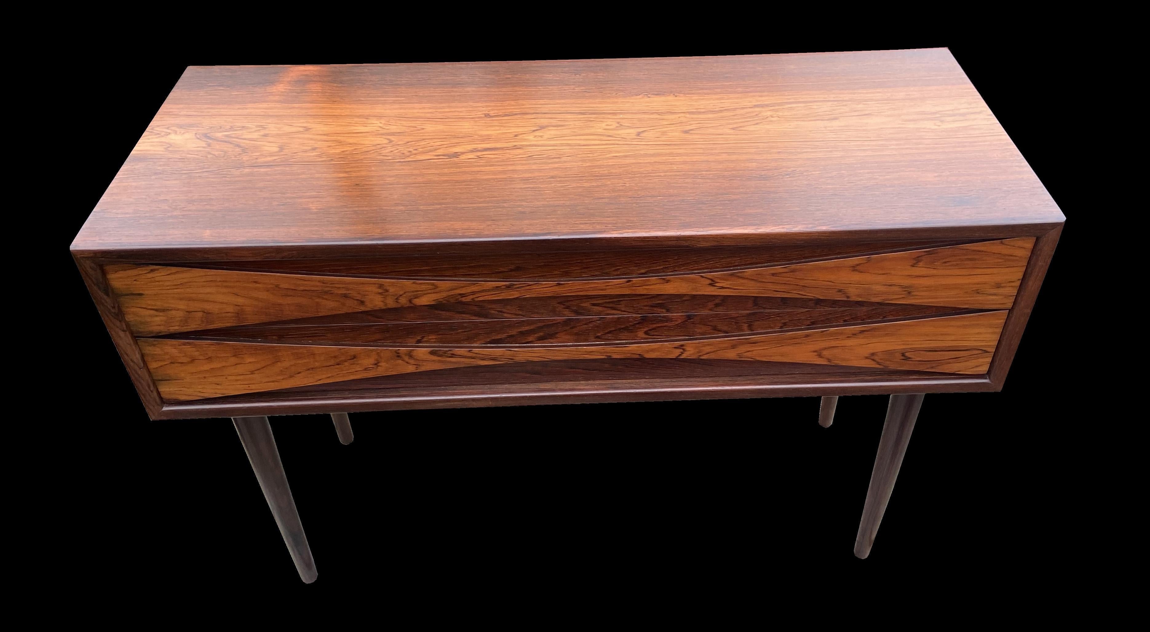 This example of the very sought after Clausen cabinet has particularly nicely marked grain and is in great condition.
The Rosewood used in this piece is Pau Ferro, A.K.A Santos Rosewood. Machaerium Scleroxylon, and is not subject to cites