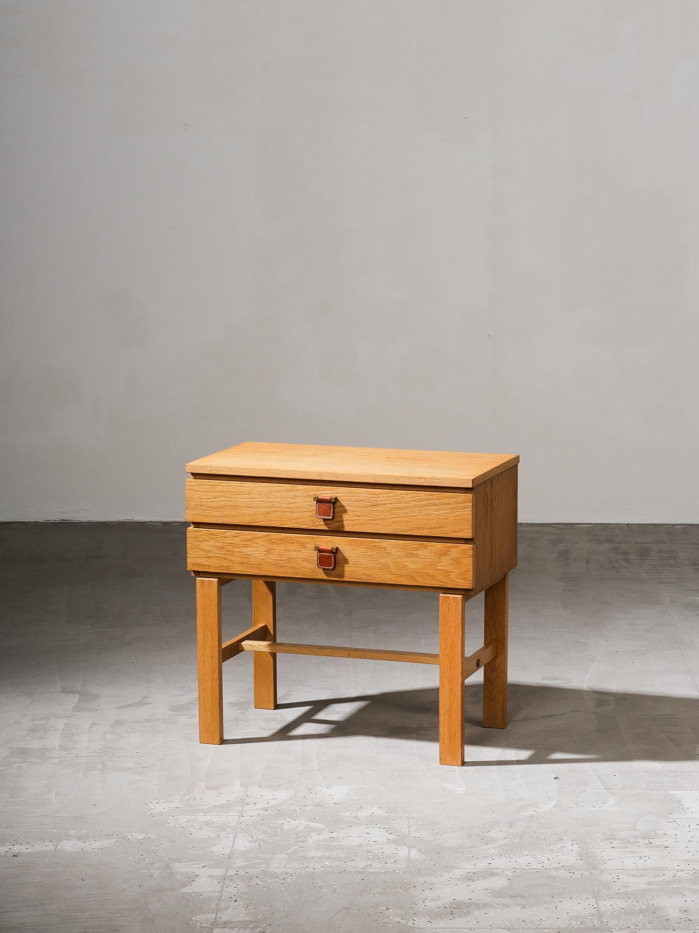 Mid-century oak bedside table with two drawers. Model 